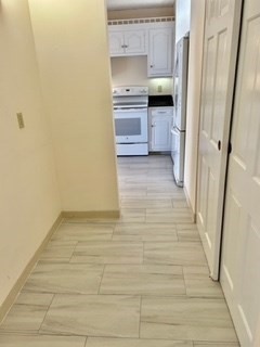 40 Village Road, Unit 610 Middleton, MA 01949 - Photo 9 of 36 a kitchen with a refrigerator and a stove