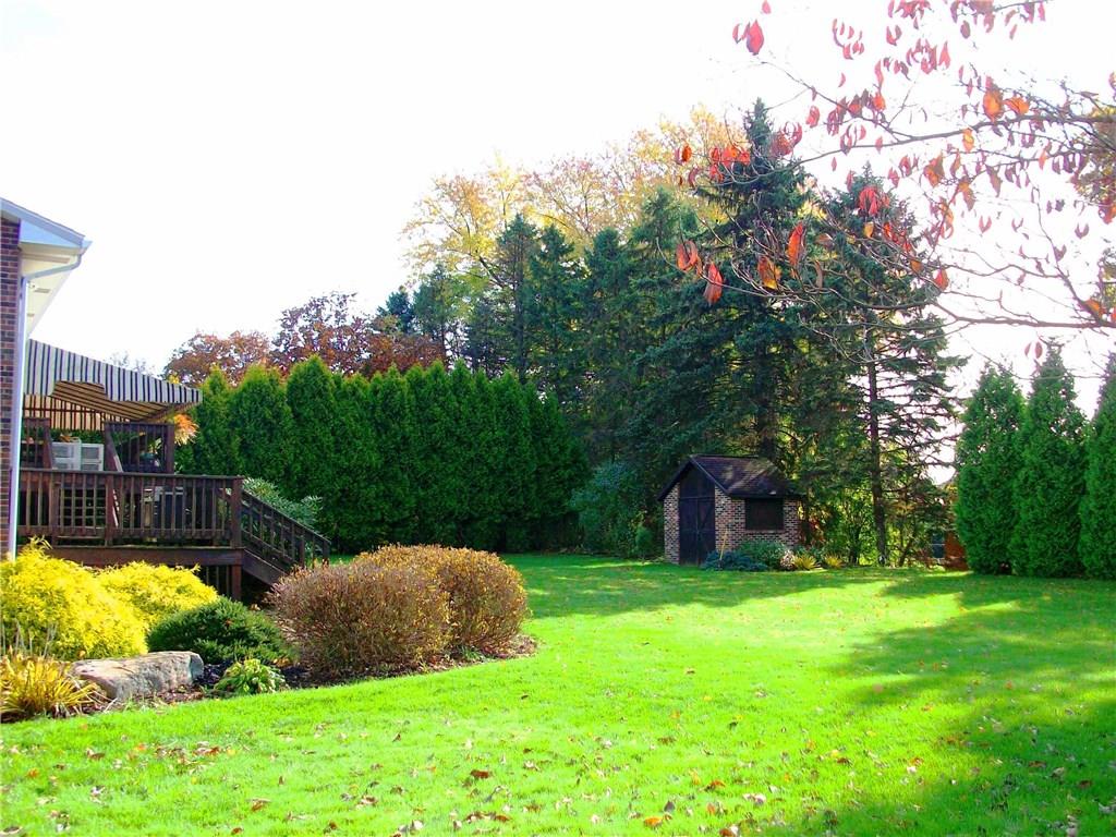 111 Meadowbrook Road Renfrew, PA 16053 - Photo 22 of 25 What's not to love about this yard? Covered and uncovered deck, a BRICK garden shed, lovely landscaping, manicured lawn and all enveloped in greenery for added privacy.