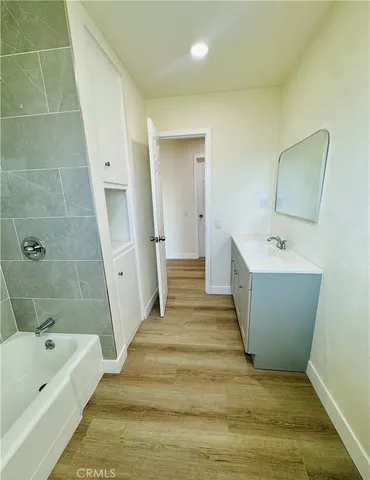 a bathroom with a sink and bathtub