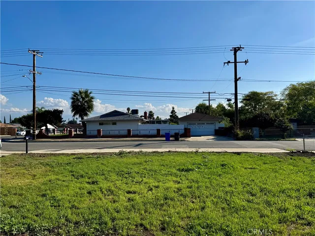 a view of a patio with table and chairs potted plants