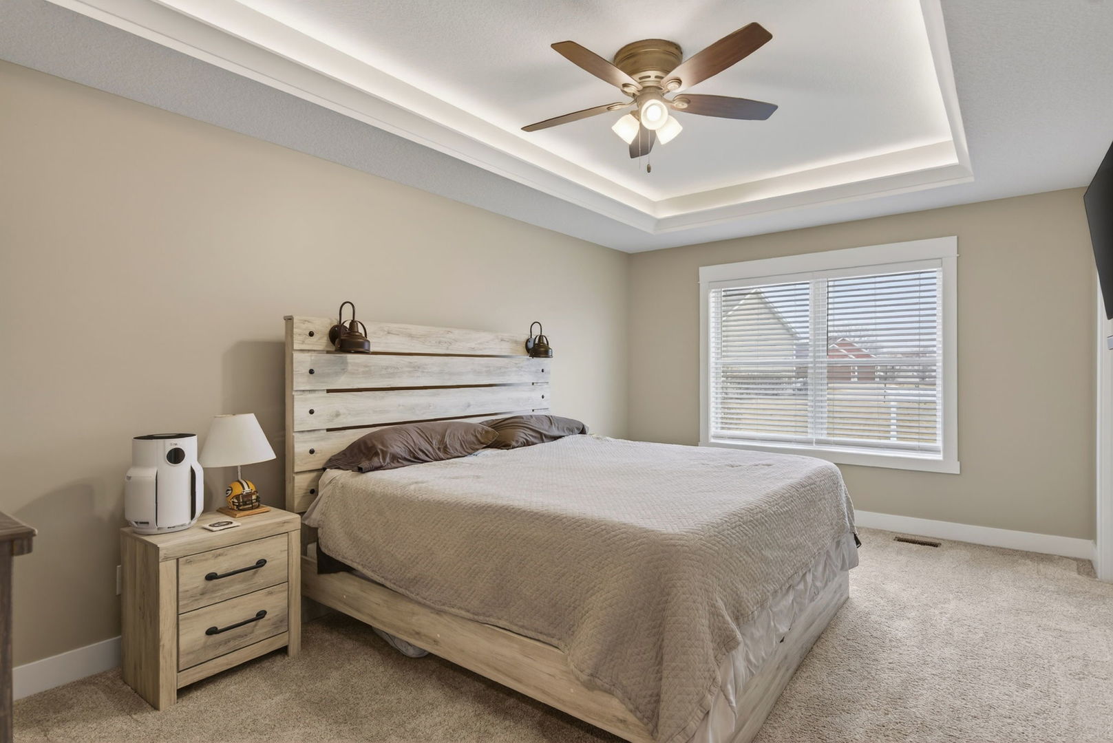 1439 Rhinelander Drive Davenport, IA 52804 - Photo 12 of 43 a bedroom with a bed chandelier and a window