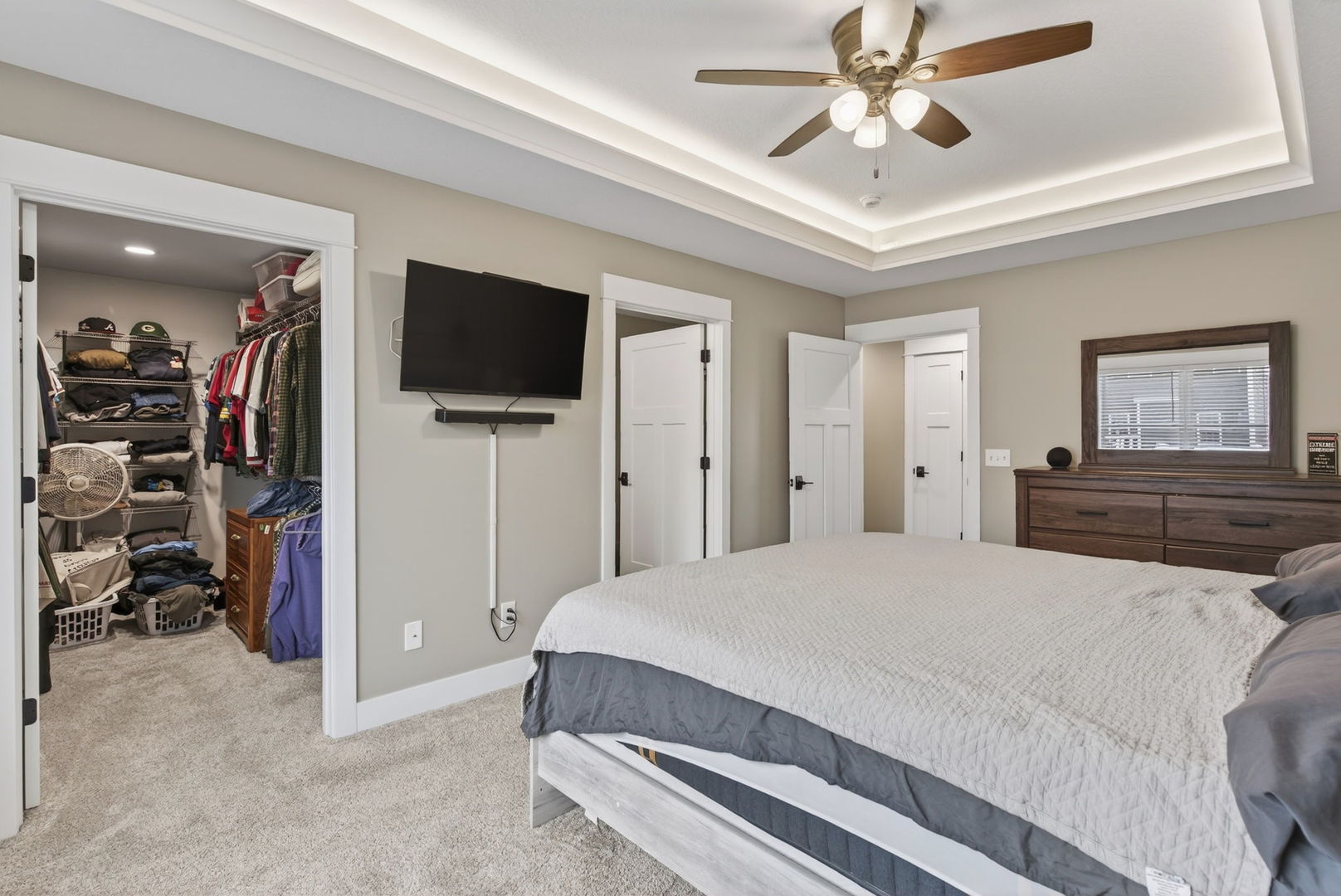 1439 Rhinelander Drive Davenport, IA 52804 - Photo 13 of 43 a bedroom with a bed and a flat screen tv