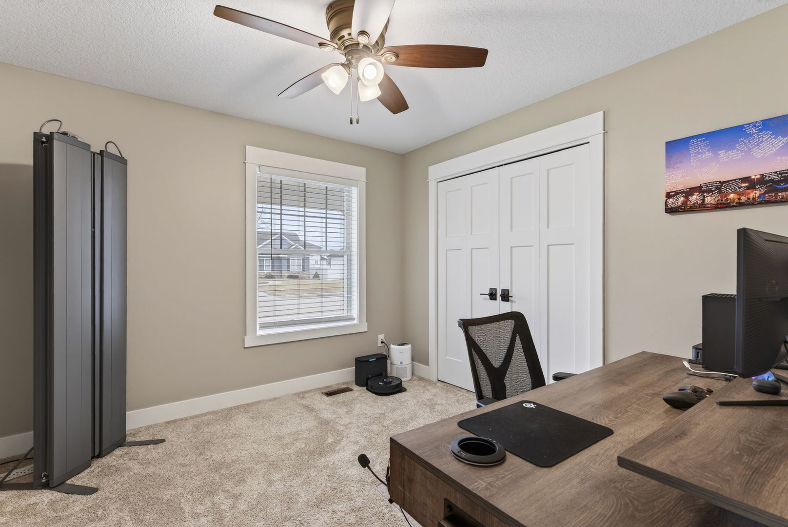 1439 Rhinelander Drive Davenport, IA 52804 - Photo 16 of 43 a view of a workspace with furniture and a window