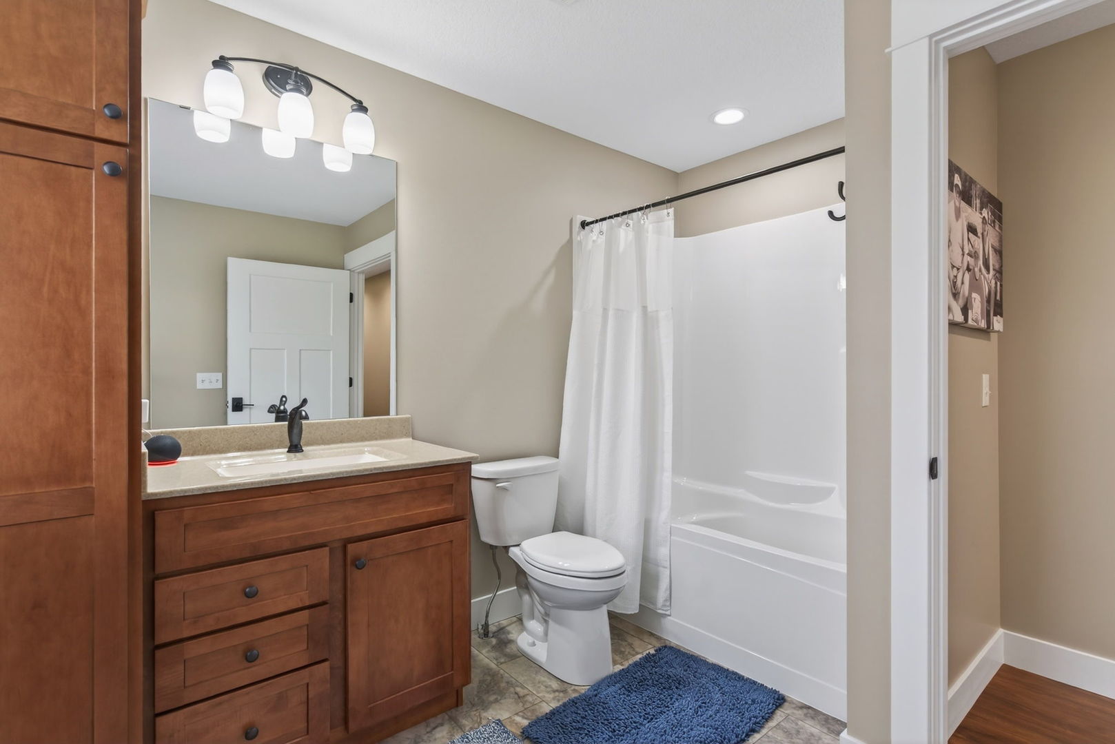 1439 Rhinelander Drive Davenport, IA 52804 - Photo 19 of 43 a bathroom with a sink a toilet and shower