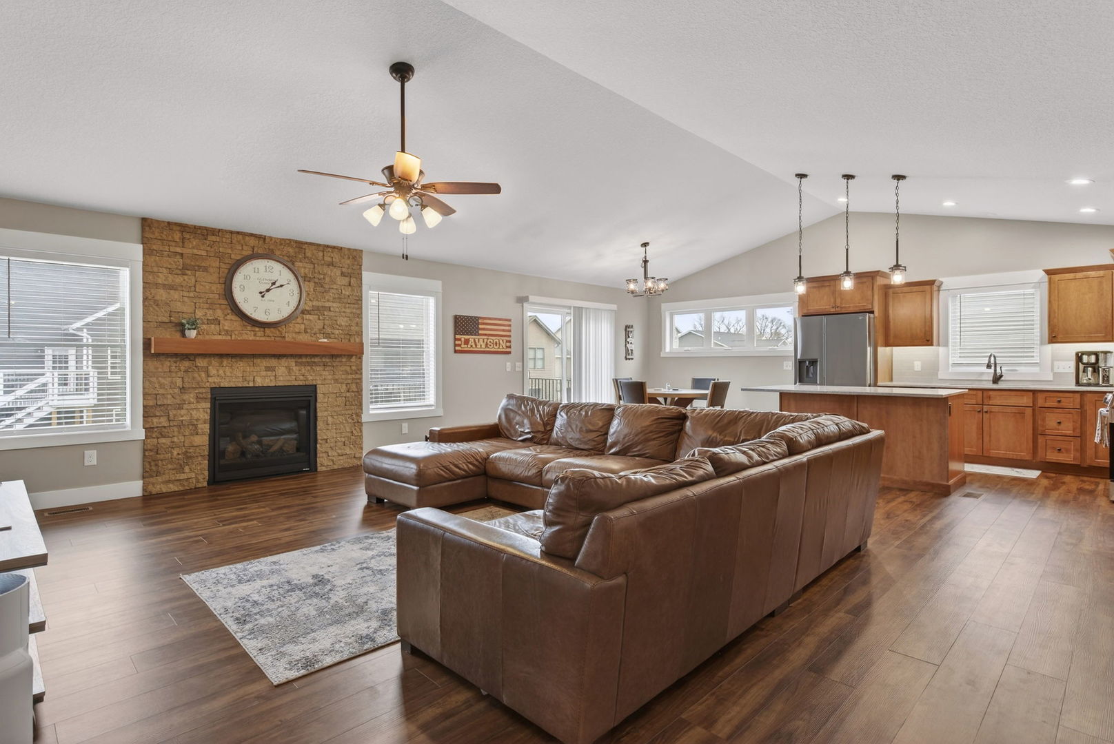 1439 Rhinelander Drive Davenport, IA 52804 - Photo 2 of 43 a living room with furniture fireplace and wooden floor