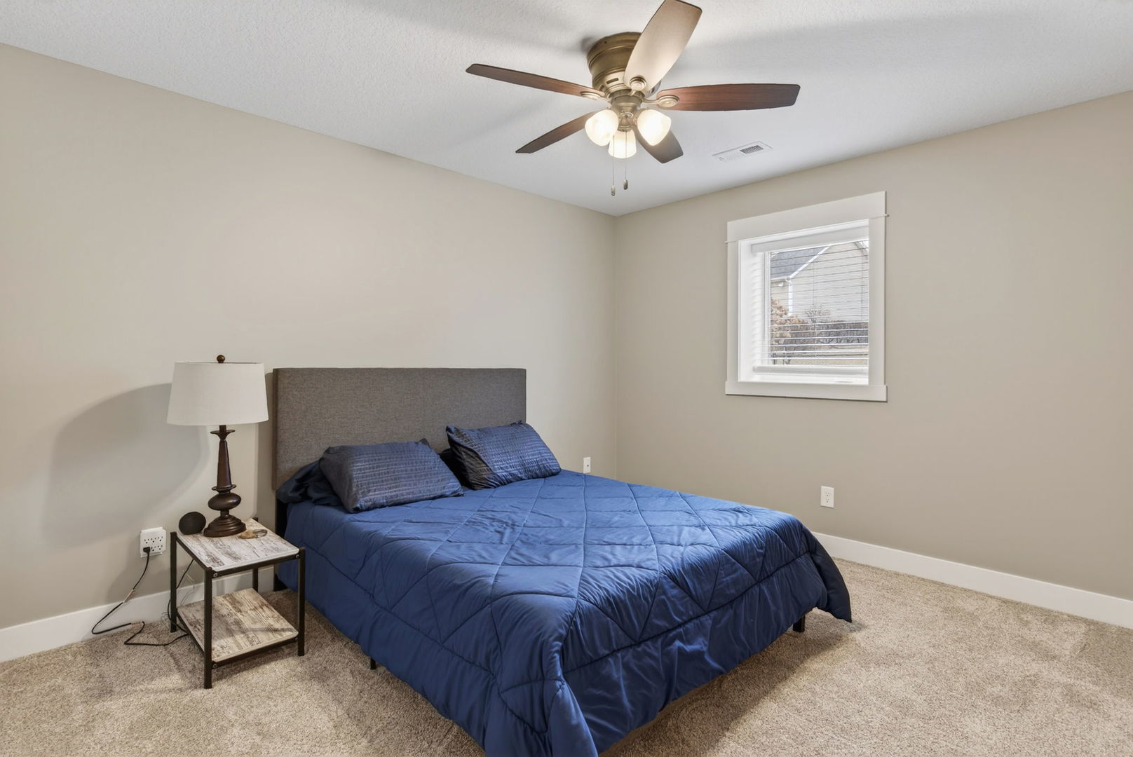 1439 Rhinelander Drive Davenport, IA 52804 - Photo 23 of 43 a bedroom with a bed mirror and a window