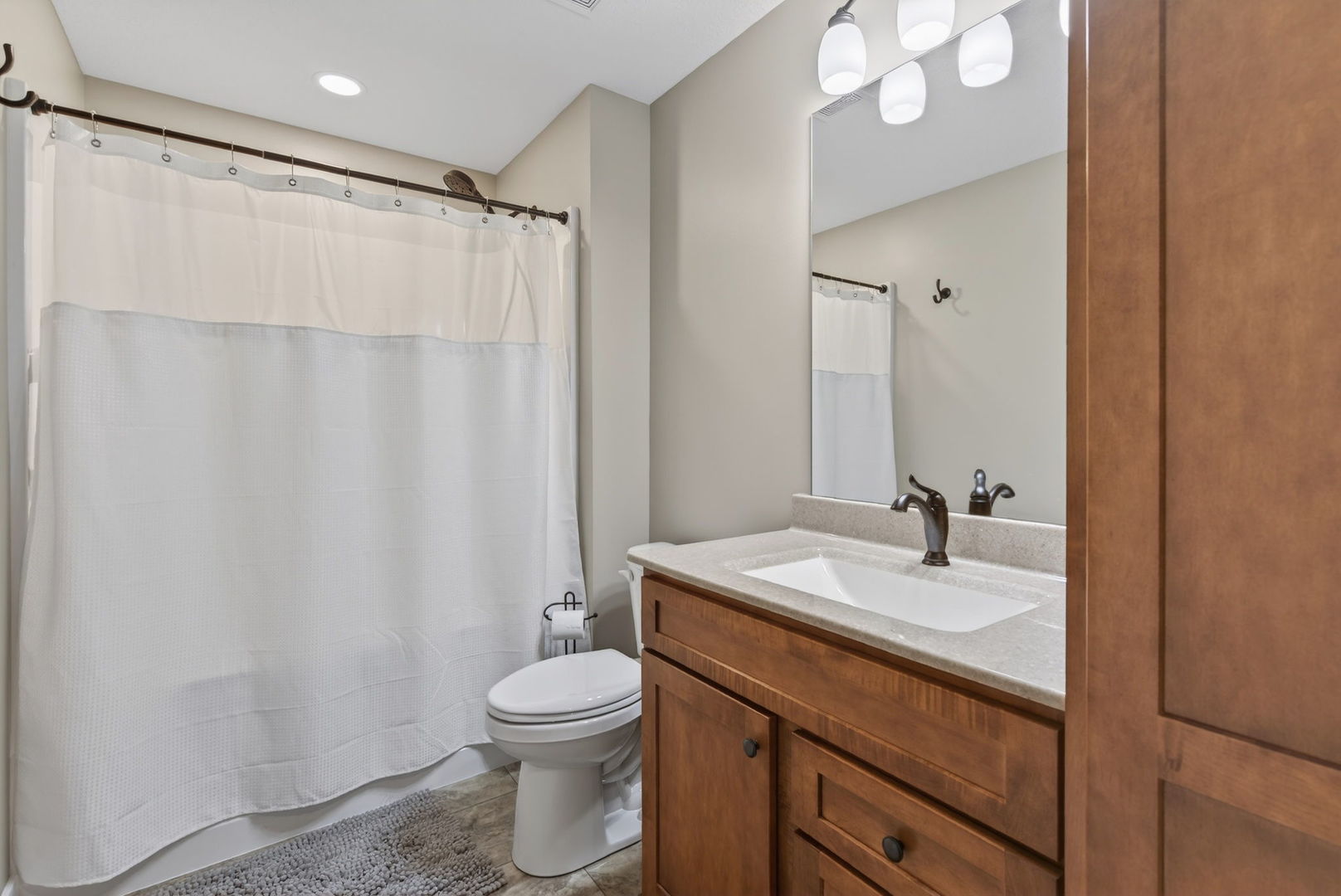 1439 Rhinelander Drive Davenport, IA 52804 - Photo 25 of 43 a bathroom with a sink a toilet and shower