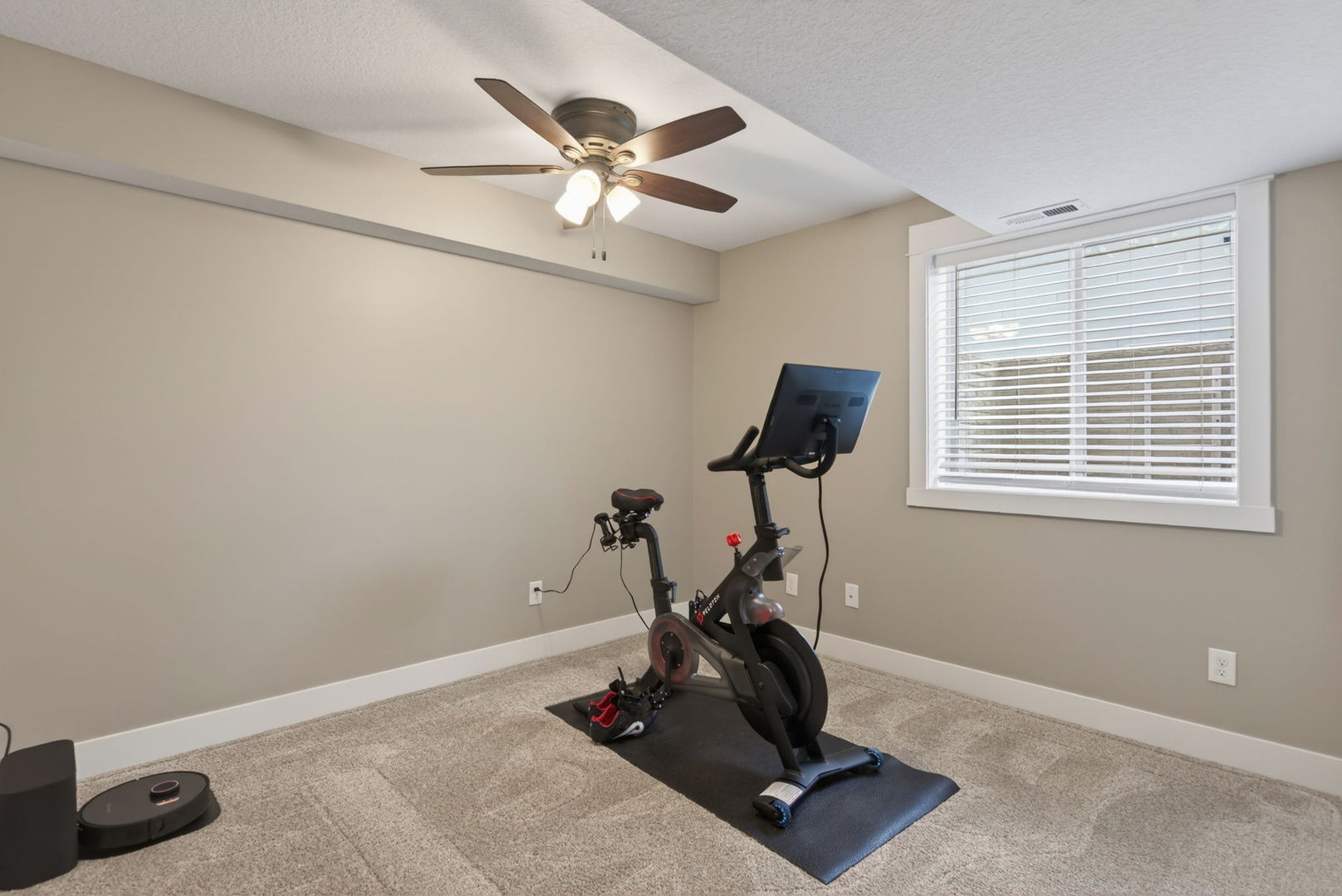 1439 Rhinelander Drive Davenport, IA 52804 - Photo 26 of 43 a room with gym equipment and windows