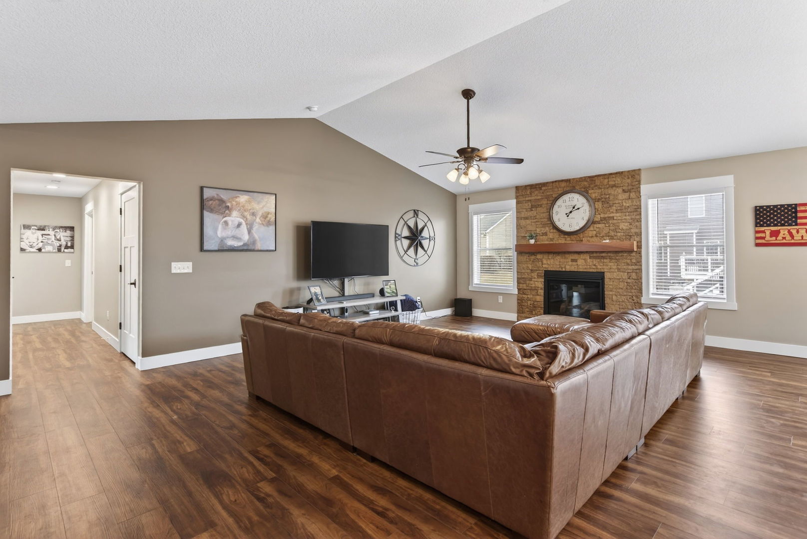 1439 Rhinelander Drive Davenport, IA 52804 - Photo 3 of 43 a living room with furniture a fireplace and a flat screen tv