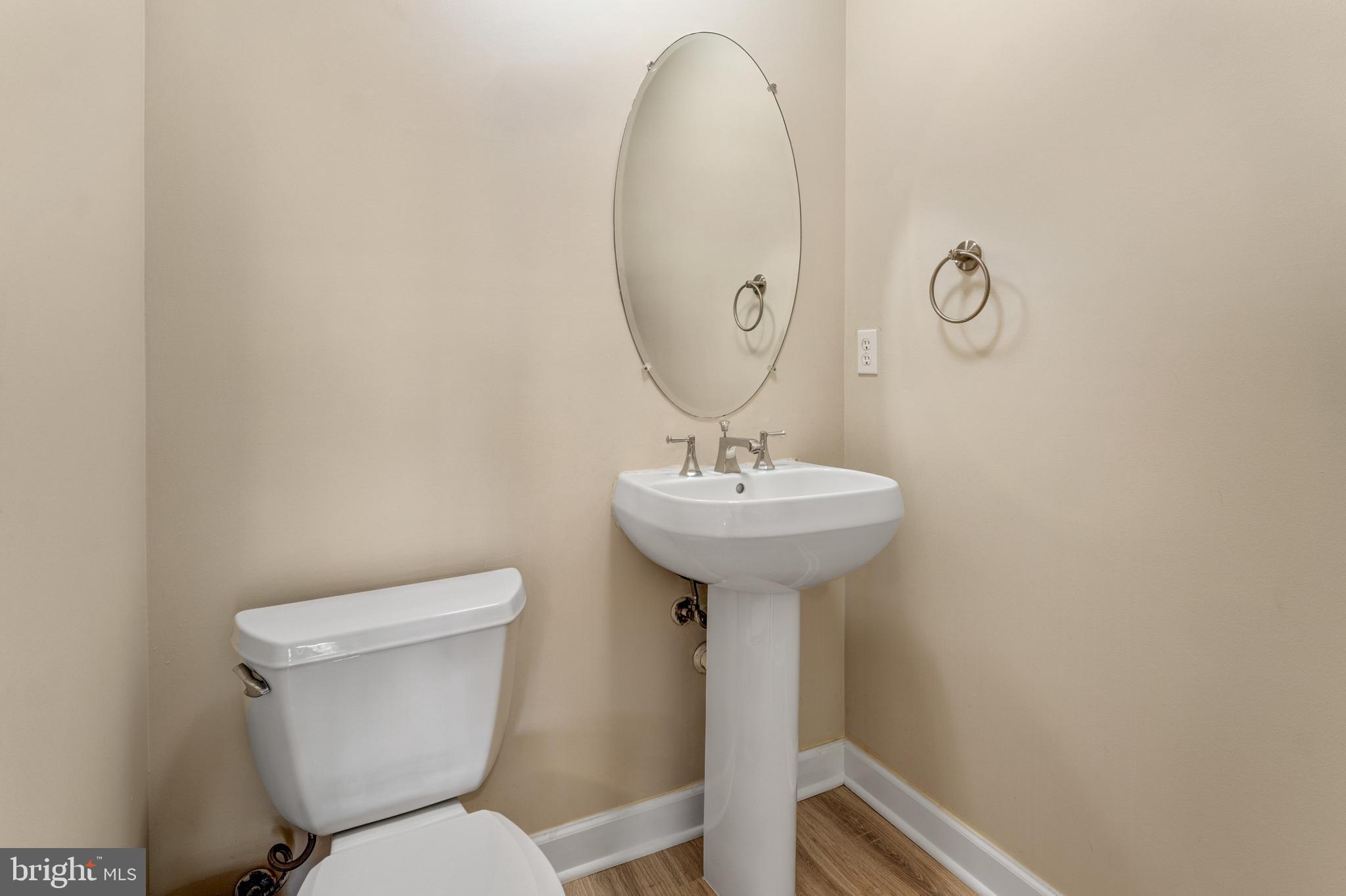 9183 Cascade Falls Drive Bristow, VA 20136 - Photo 14 of 45 a bathroom with a sink toilet and a mirror