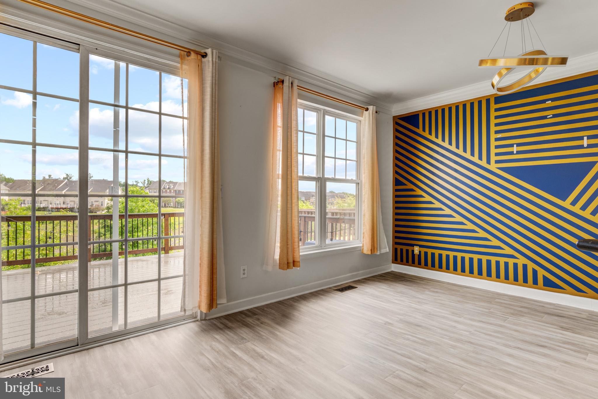 9183 Cascade Falls Drive Bristow, VA 20136 - Photo 19 of 45 an empty room with wooden floor and windows