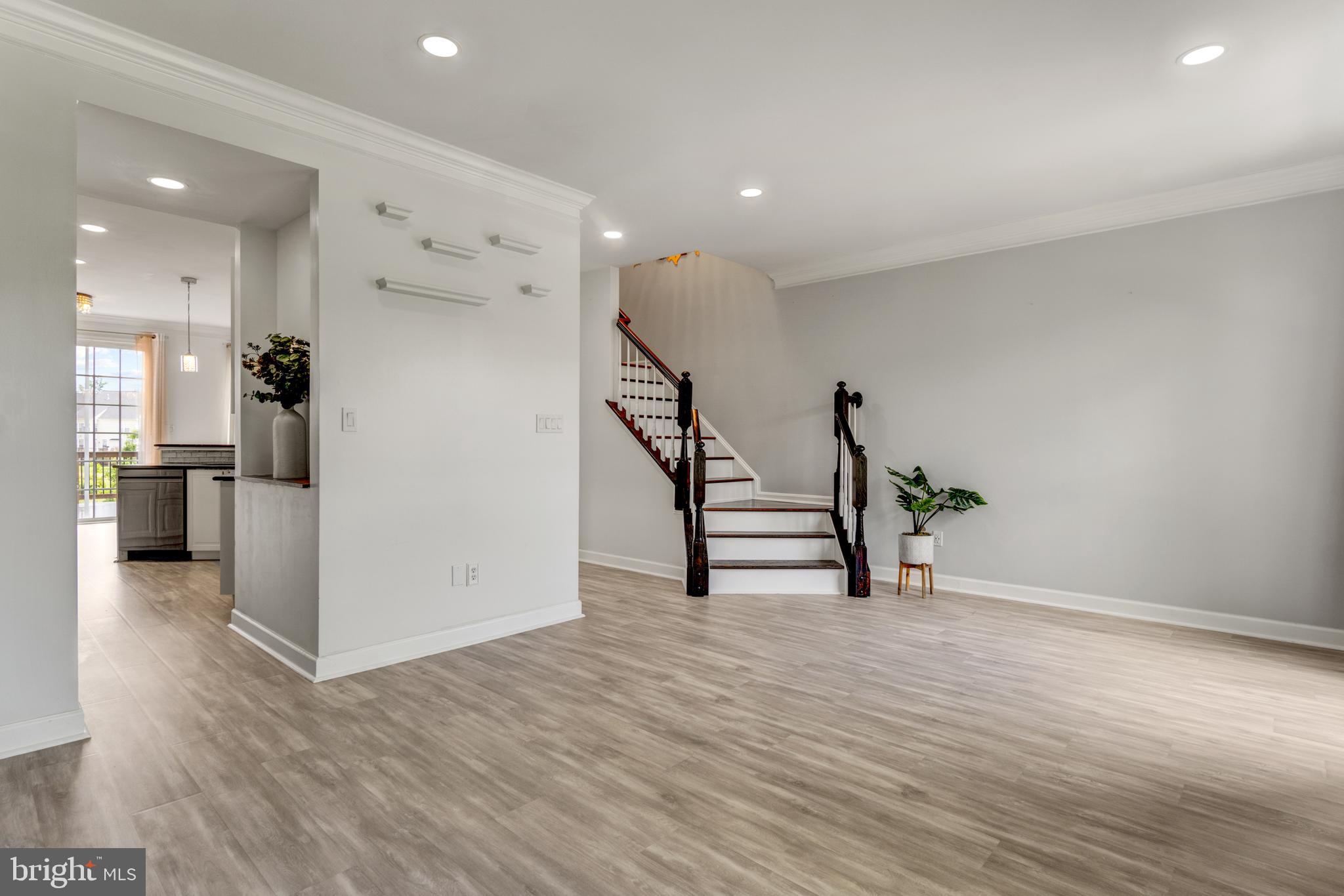 9183 Cascade Falls Drive Bristow, VA 20136 - Photo 22 of 45 a view of a kitchen with furniture and wooden floor