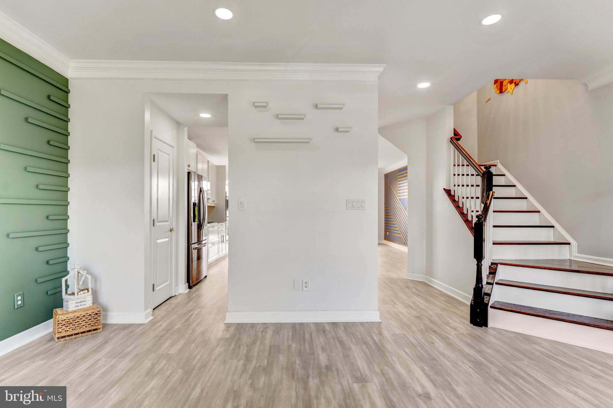 9183 Cascade Falls Drive Bristow, VA 20136 - Photo 23 of 45 a view of entryway with wooden floor and stairs