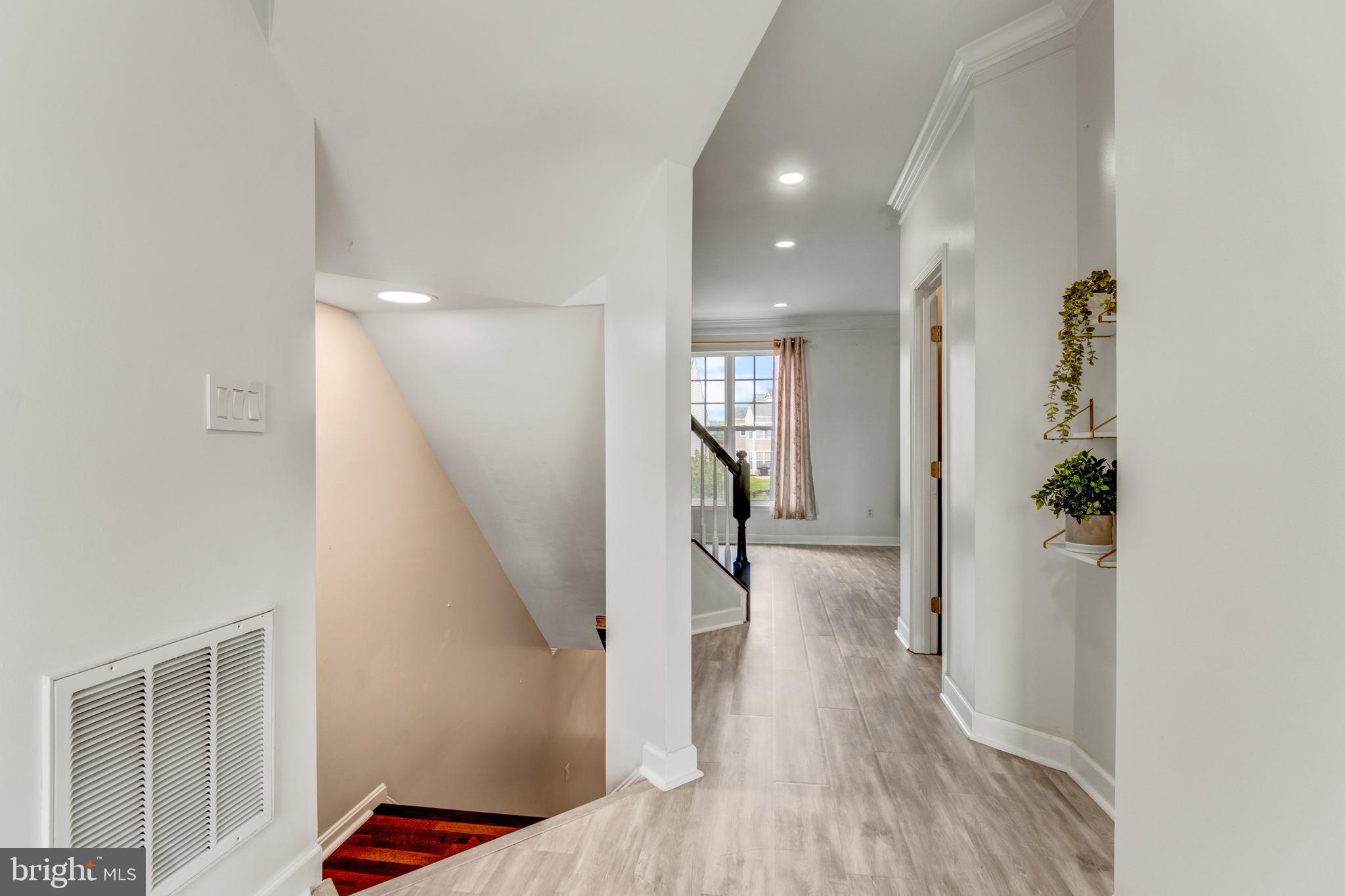 9183 Cascade Falls Drive Bristow, VA 20136 - Photo 28 of 45 a view of entryway and hall with wooden floor