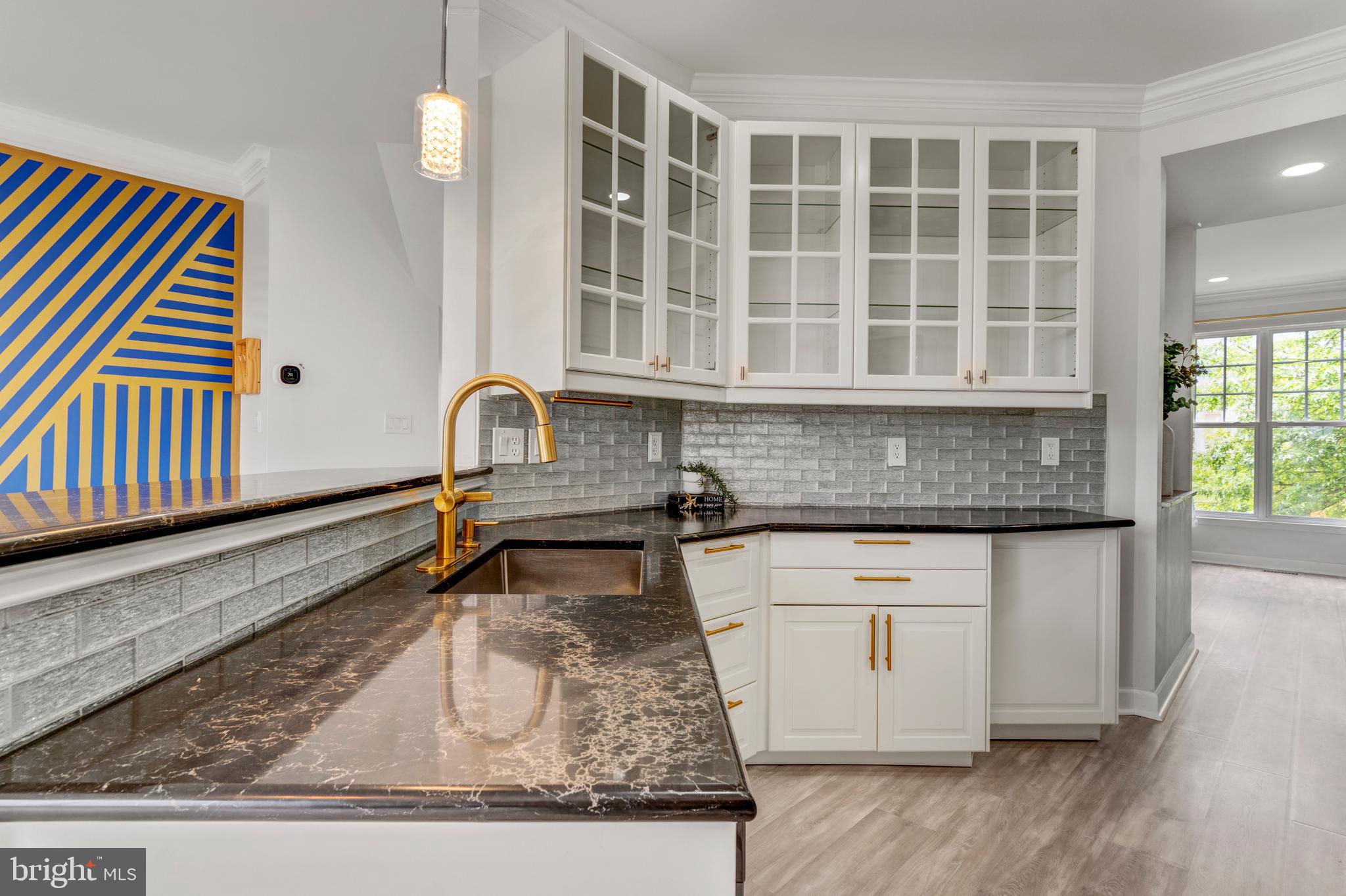 9183 Cascade Falls Drive Bristow, VA 20136 - Photo 3 of 45 a kitchen with a refrigerator and a sink