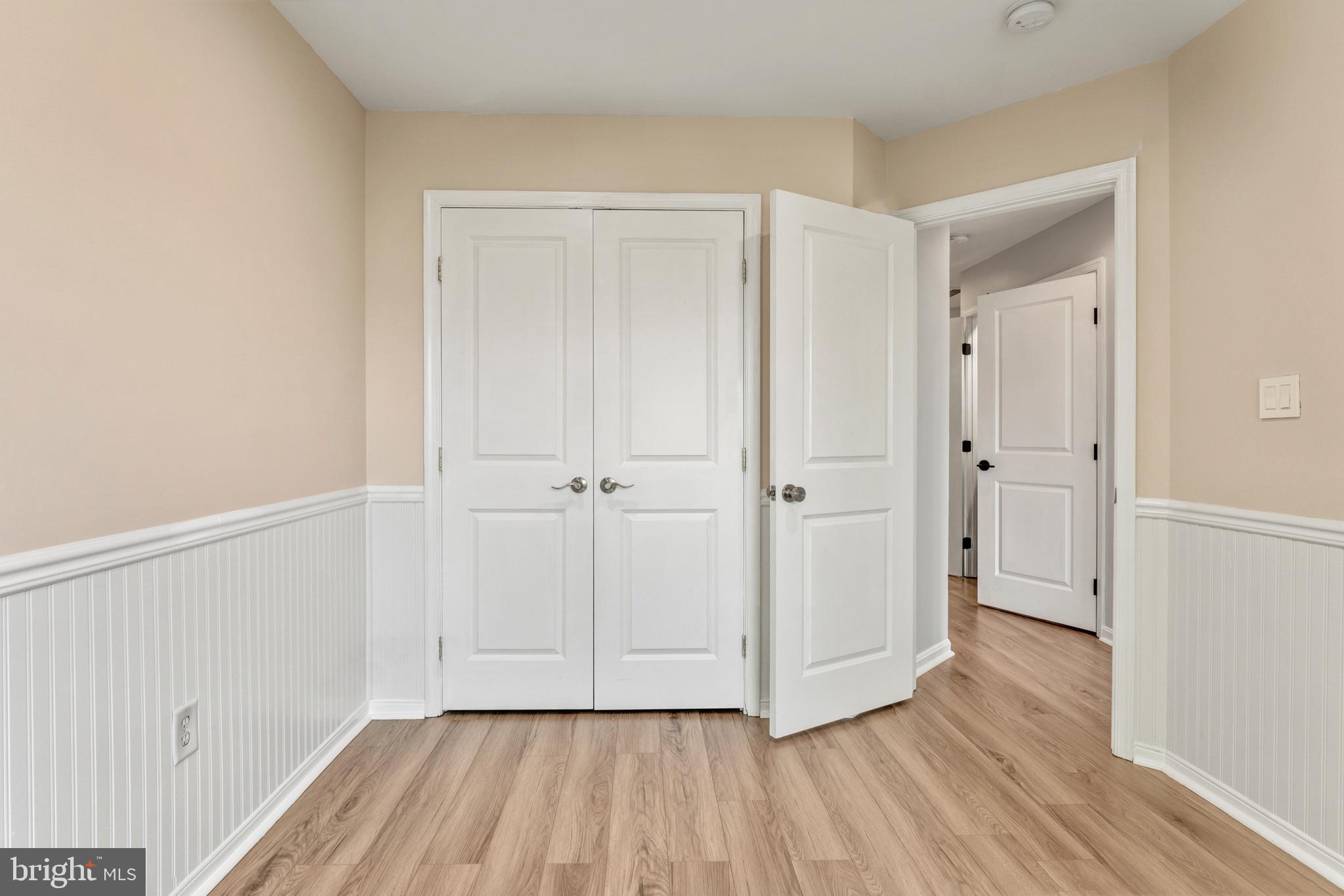 9183 Cascade Falls Drive Bristow, VA 20136 - Photo 39 of 45 a view of an empty room and wooden floor