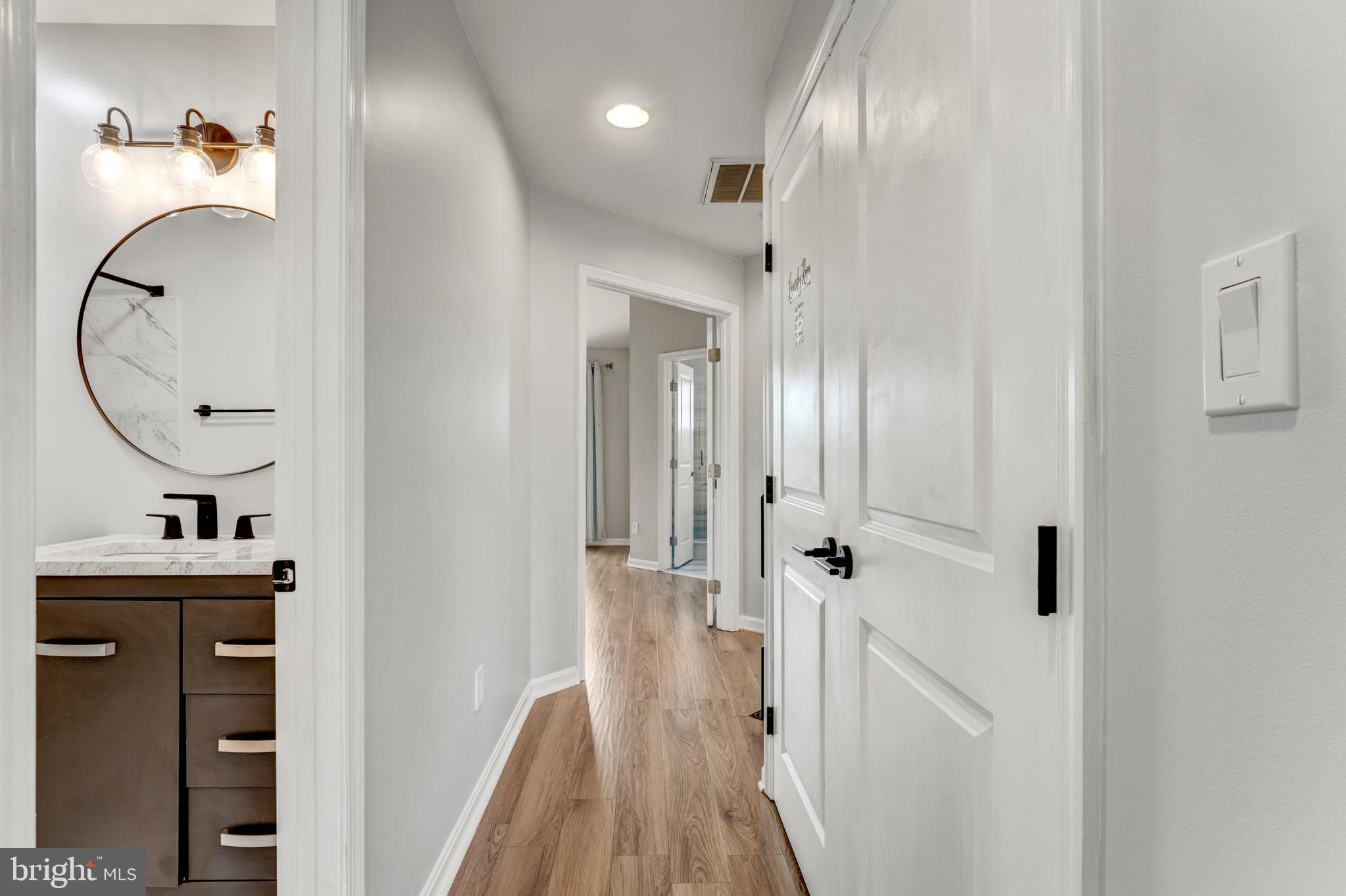 9183 Cascade Falls Drive Bristow, VA 20136 - Photo 44 of 45 a bathroom with a sink and a mirror