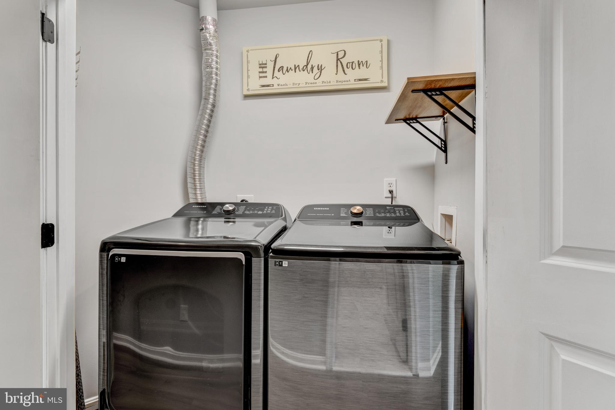 9183 Cascade Falls Drive Bristow, VA 20136 - Photo 45 of 45 a utility room with dryer and washer
