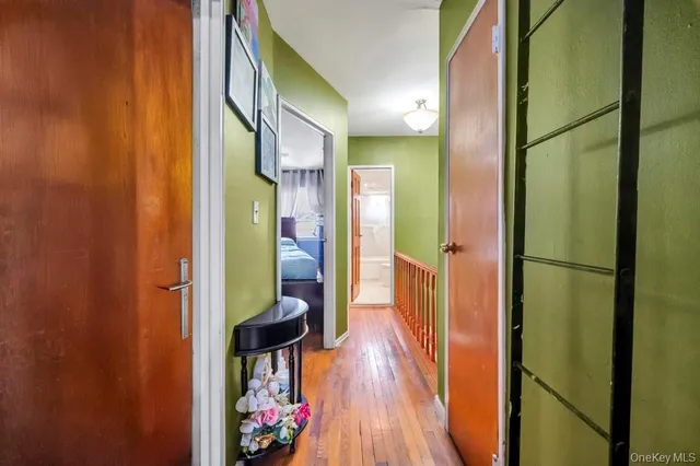 view of hallway with wooden floor