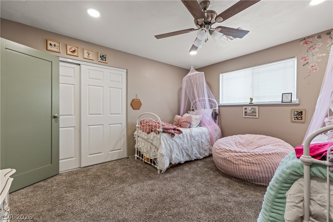 750 Leming Avenue Overton, NV 89040 - Photo 52 of 82 This cozy bedroom features carpeted floors and a practical ceiling fan, ideal for comfort.
