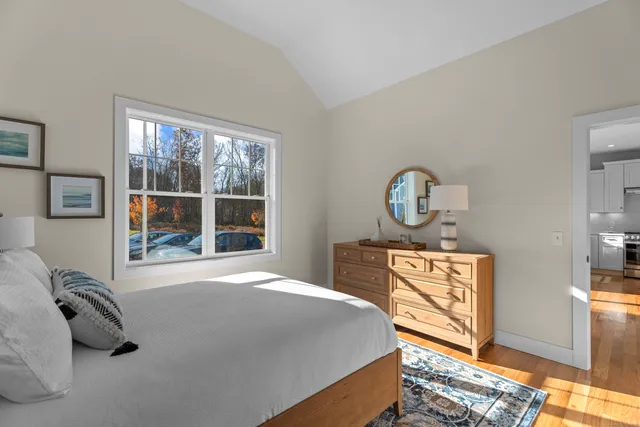 a bedroom with bed and a window