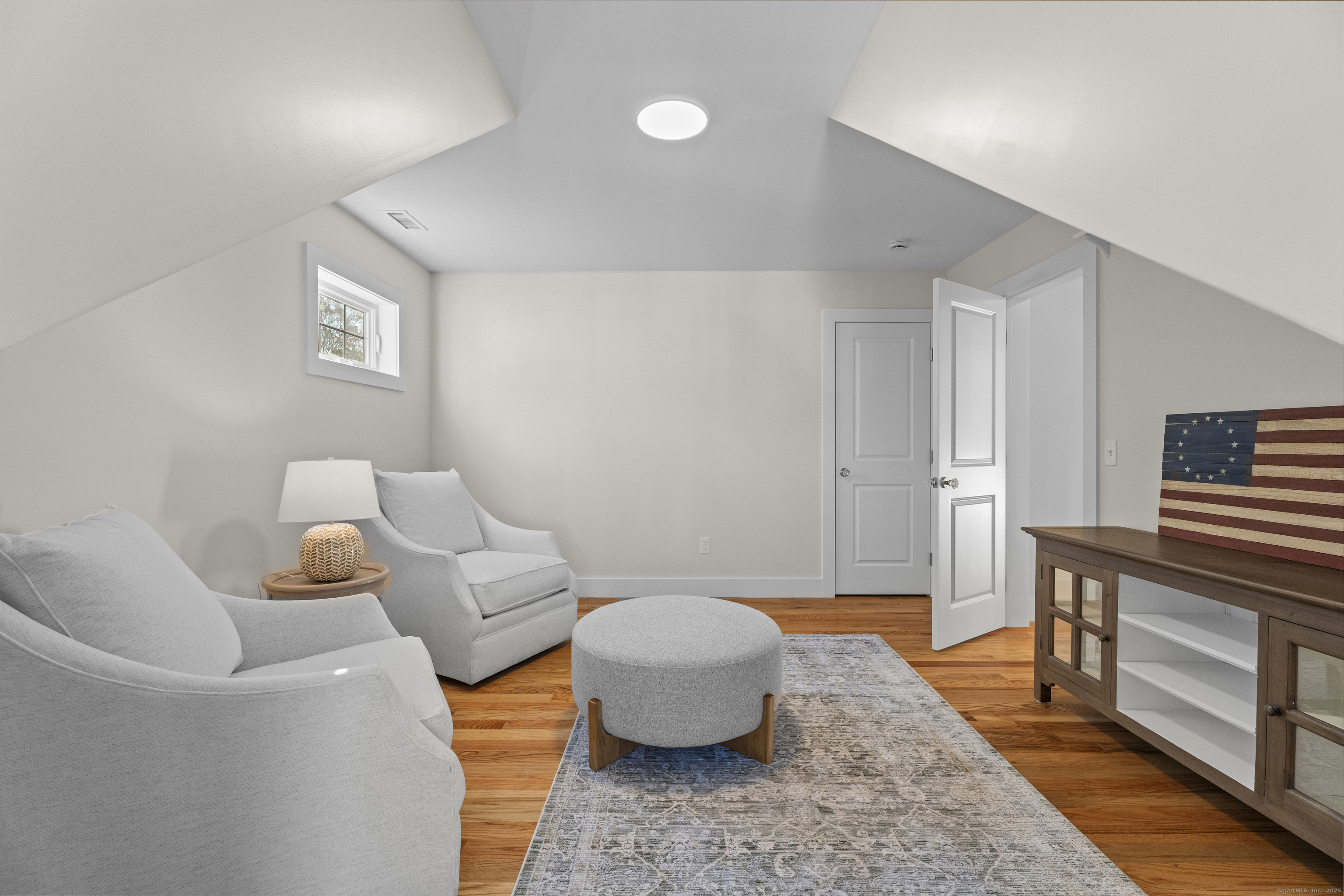 7 Ivy Hill Road, Unit 7 Waterford, CT 06385 - Photo 25 of 35 a living room with furniture and a wooden floor