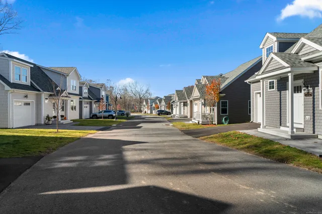 a view of a house with a street