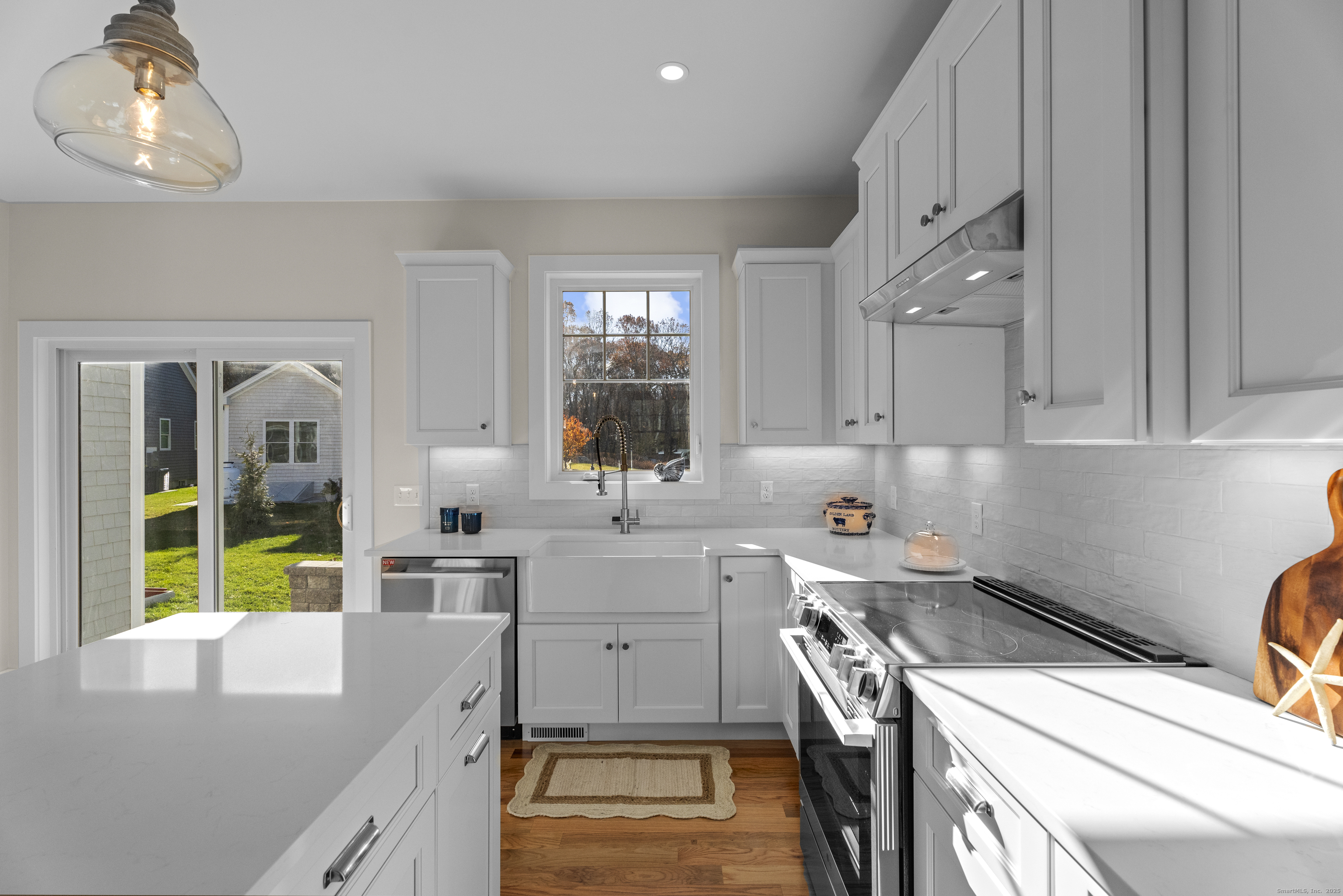 7 Ivy Hill Road, Unit 7 Waterford, CT 06385 - Photo 5 of 35 a kitchen that has a lot of cabinets in it and wooden floor