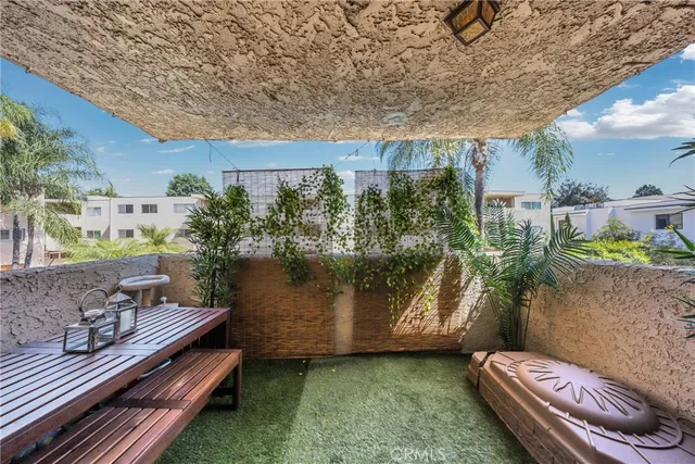 a backyard of a house with outdoor seating