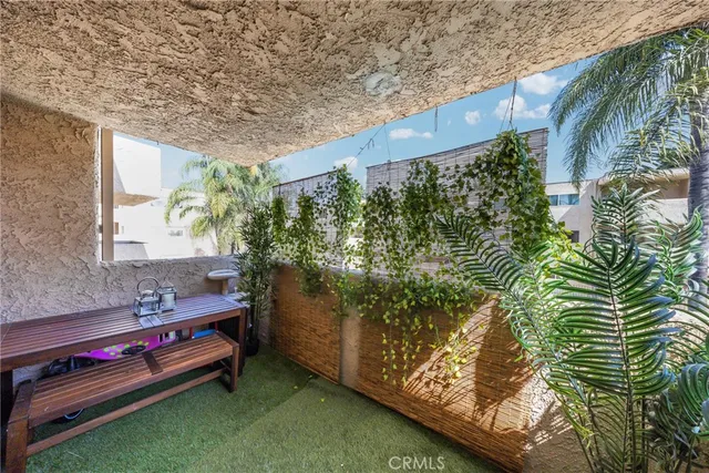 a backyard of a house with outdoor seating