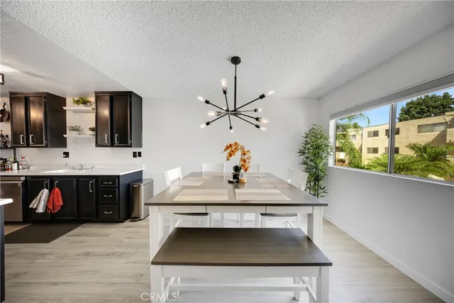 a kitchen with stainless steel appliances granite countertop a stove and a sink