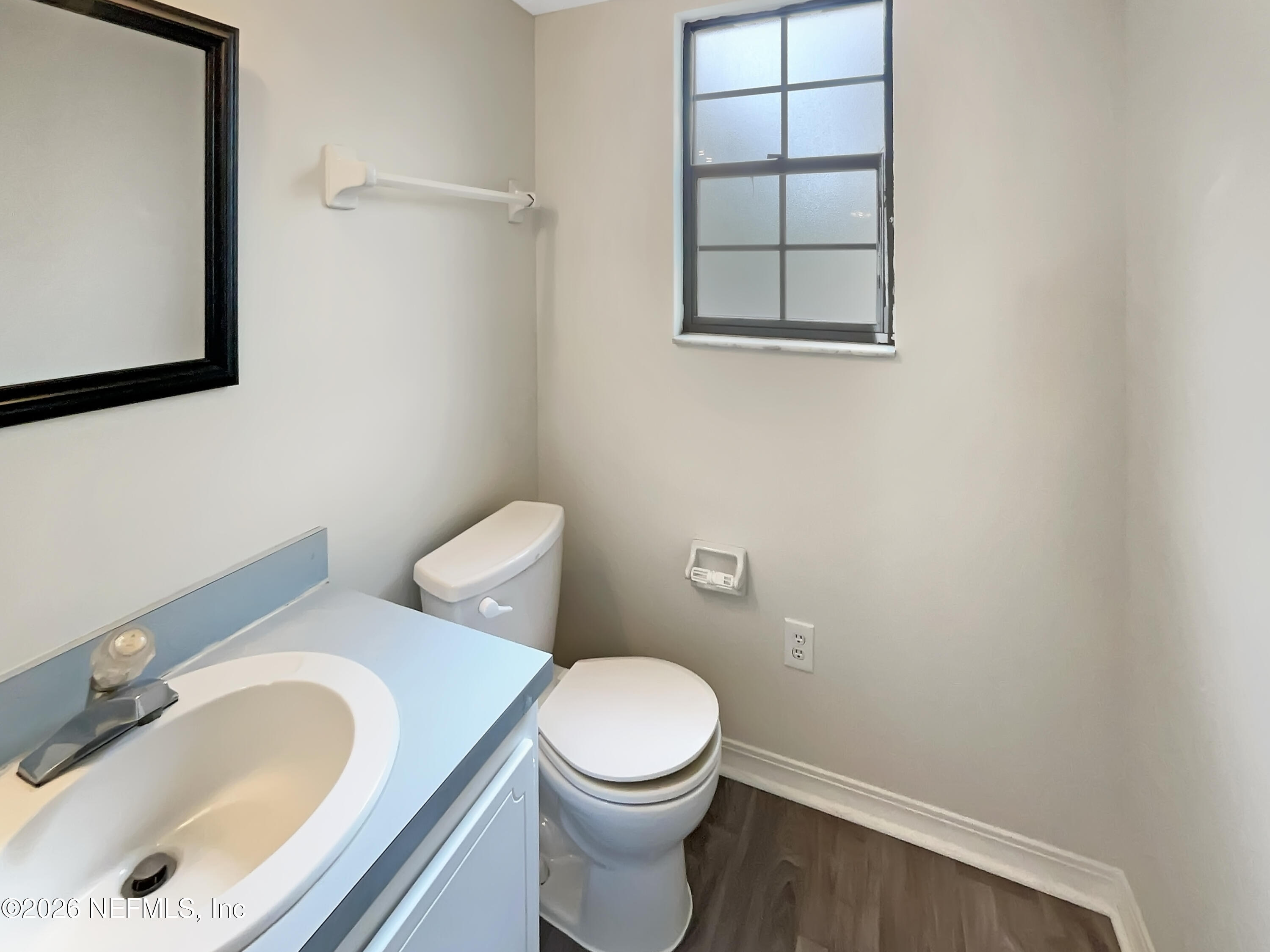 1555 Dolph Road Jacksonville, FL 32220 - Photo 11 of 21 a white toilet sitting next to a bathroom sink