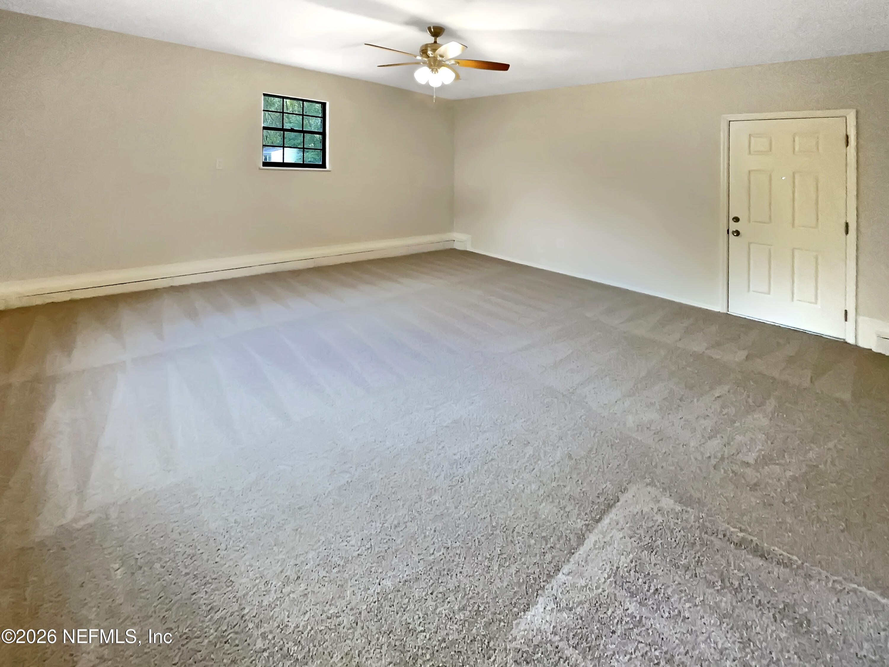 1555 Dolph Road Jacksonville, FL 32220 - Photo 12 of 21 an empty room with a empty space and a ceiling fan