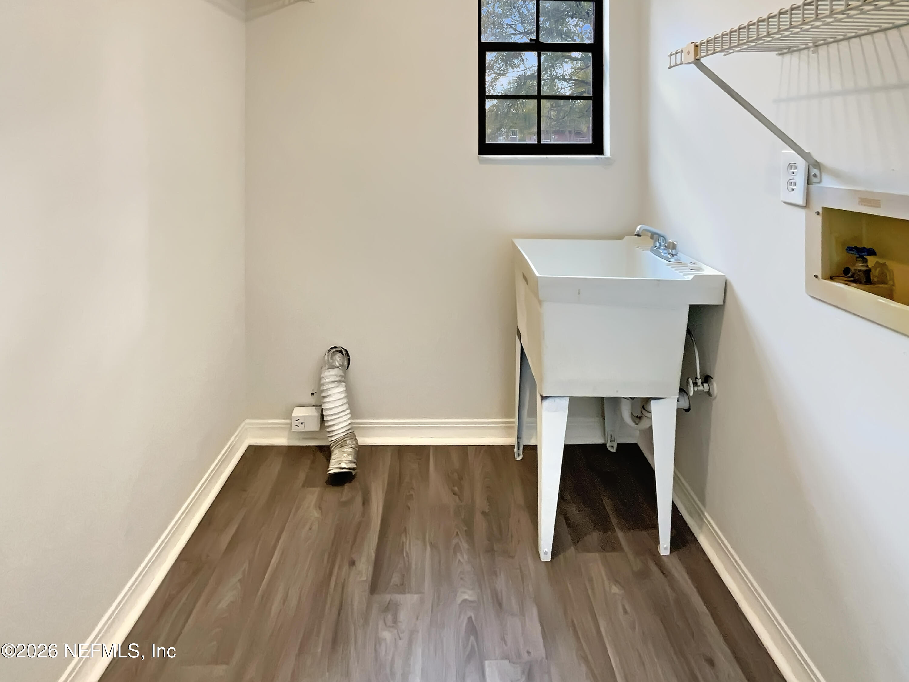 1555 Dolph Road Jacksonville, FL 32220 - Photo 13 of 21 a view of a room with wooden floor table and chairs