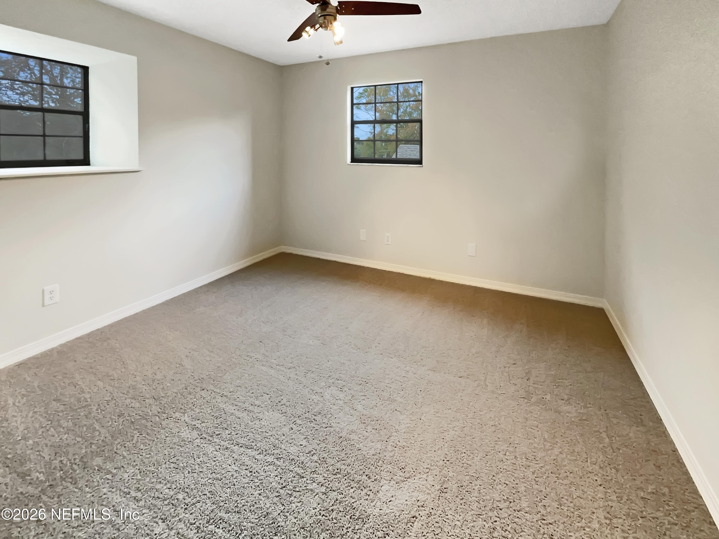 1555 Dolph Road Jacksonville, FL 32220 - Photo 17 of 21 an empty room with windows