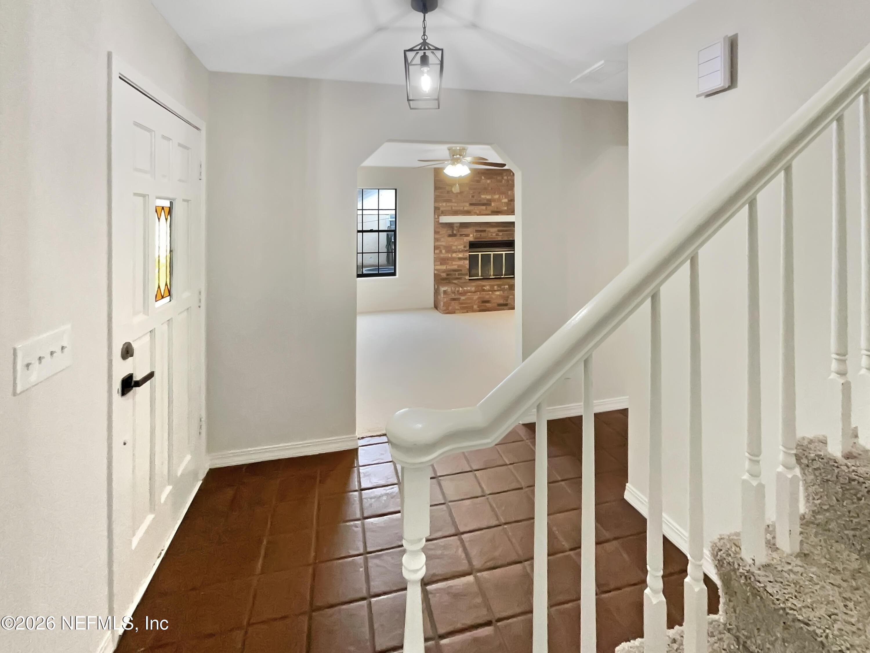 1555 Dolph Road Jacksonville, FL 32220 - Photo 18 of 21 a view of entryway with wooden floor and stair