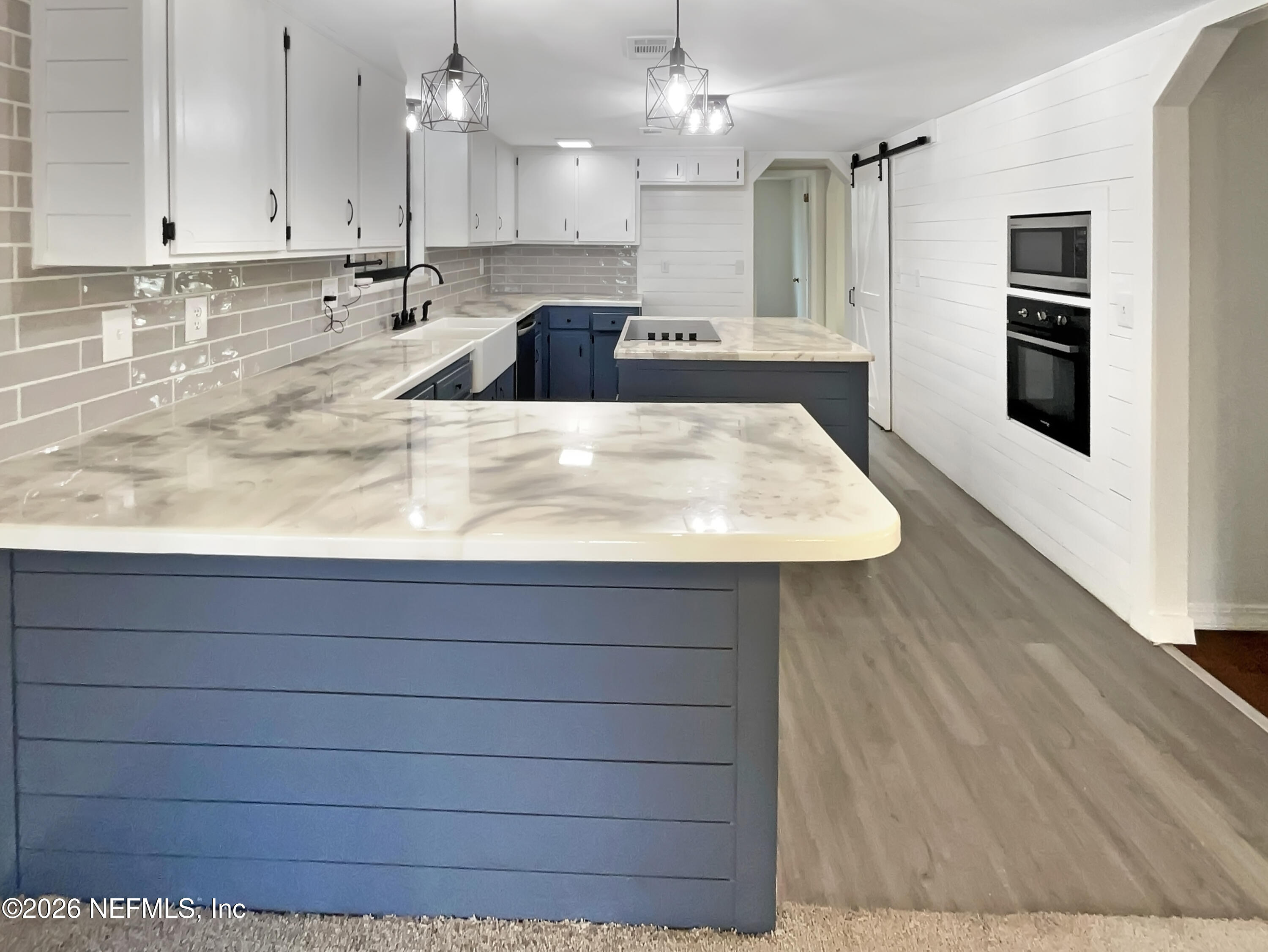 1555 Dolph Road Jacksonville, FL 32220 - Photo 2 of 21 a kitchen with kitchen island sink and refrigerator