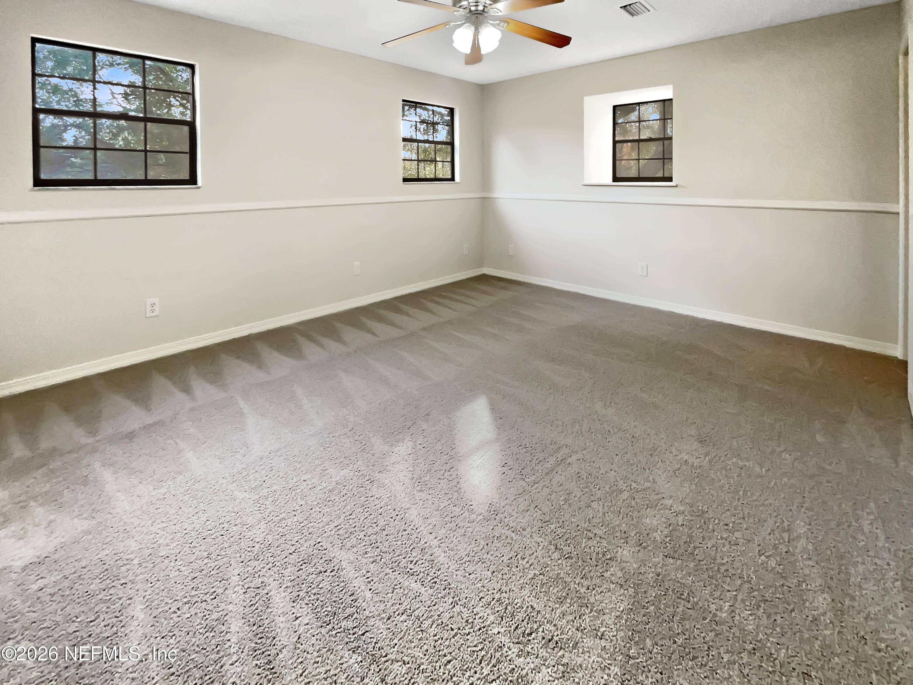 1555 Dolph Road Jacksonville, FL 32220 - Photo 4 of 21 a view of empty room with windows