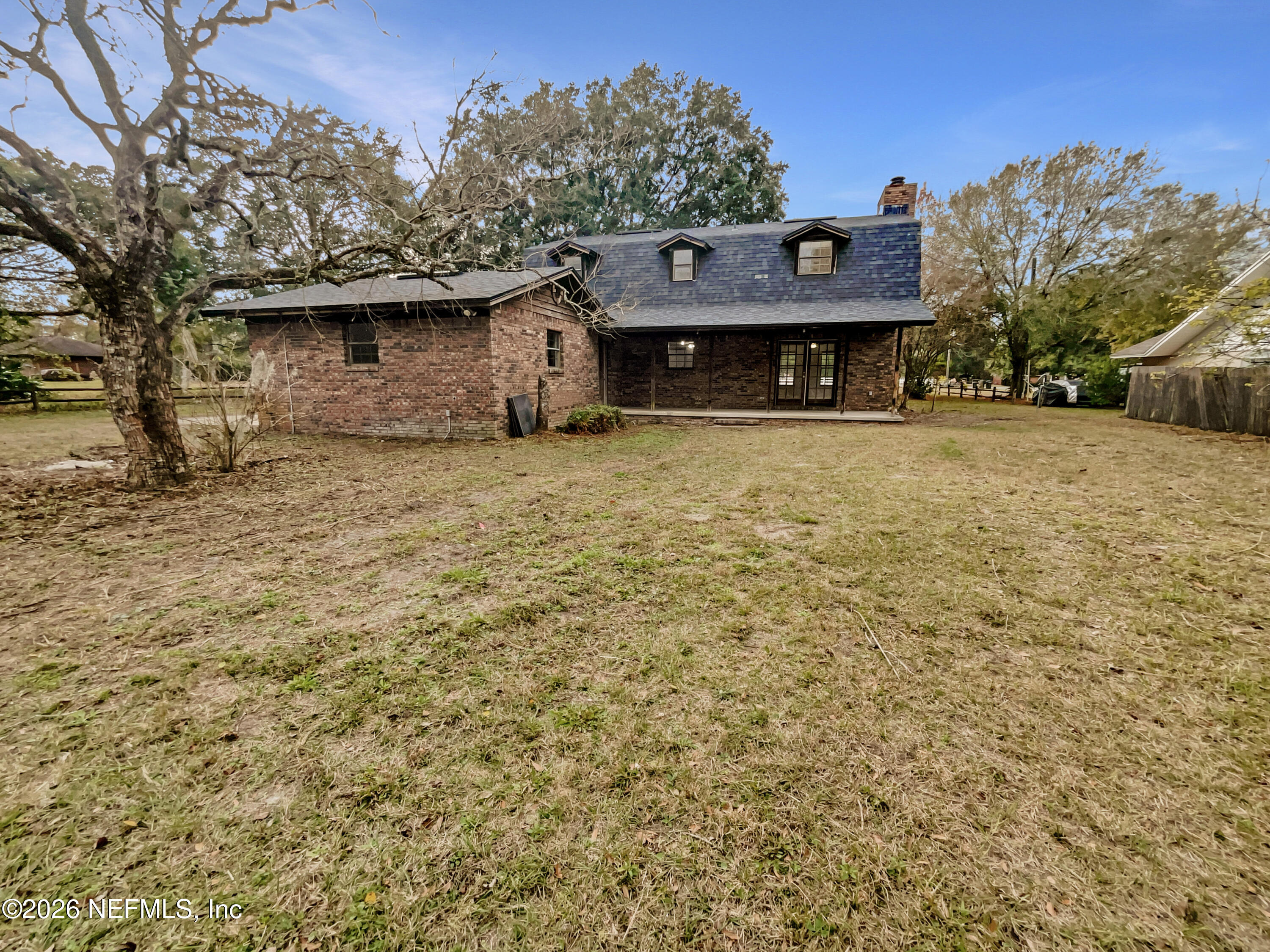 1555 Dolph Road Jacksonville, FL 32220 - Photo 5 of 21 a view of a house with a yard and tree s