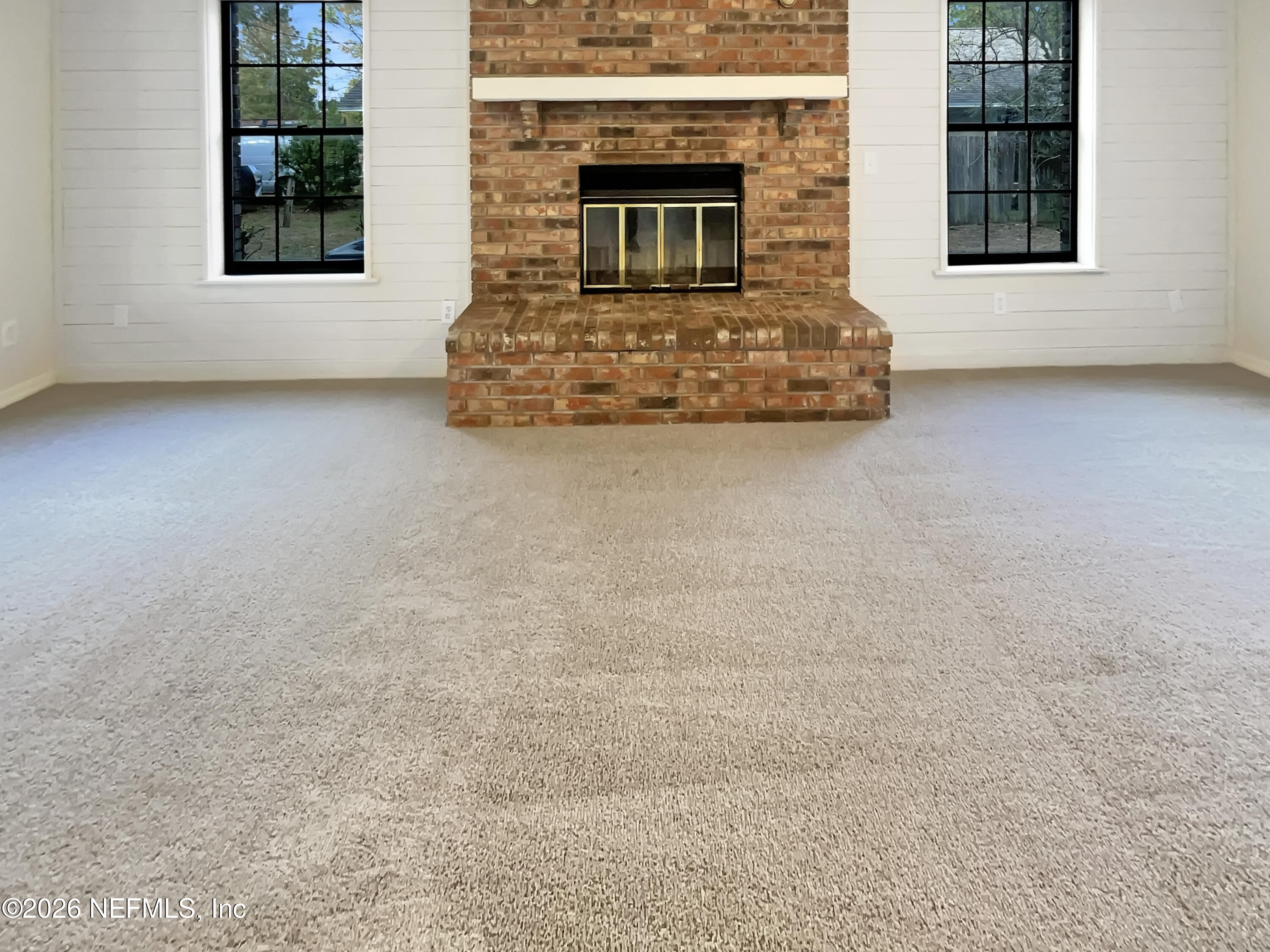 1555 Dolph Road Jacksonville, FL 32220 - Photo 9 of 21 a room with a fireplace and windows