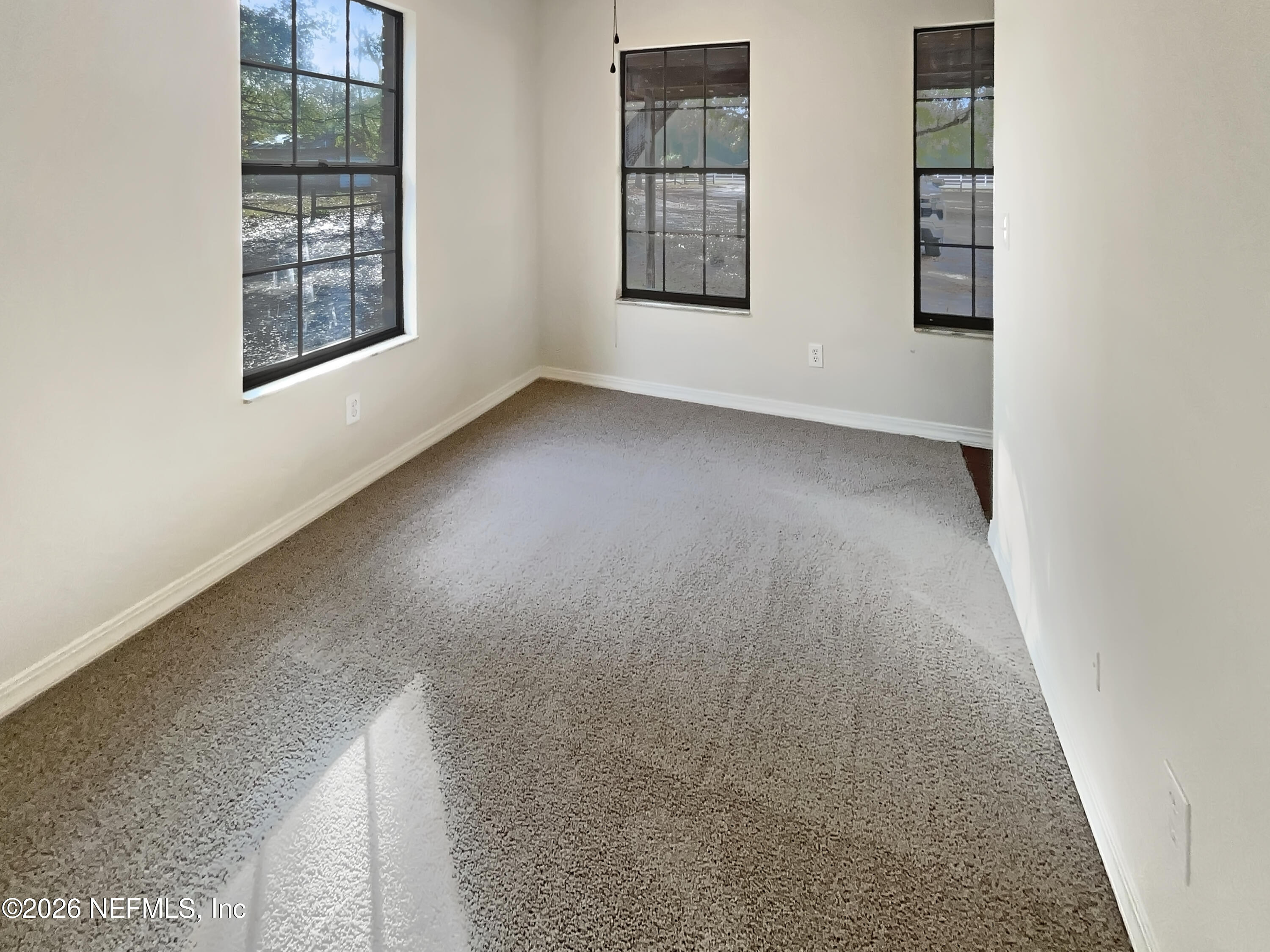 1555 Dolph Road Jacksonville, FL 32220 - Photo 10 of 21 an empty room with windows