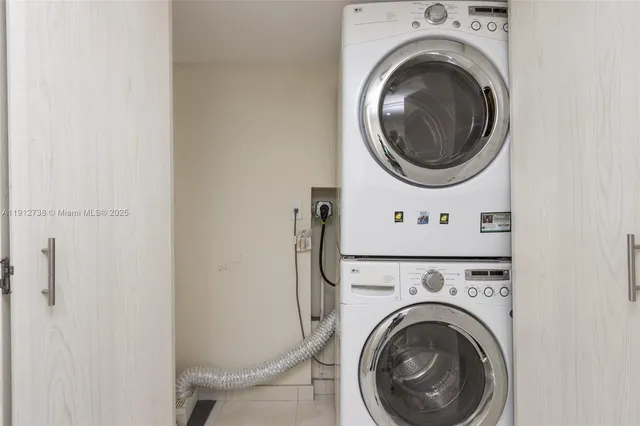 a bathroom with a granite countertop sink double and mirror