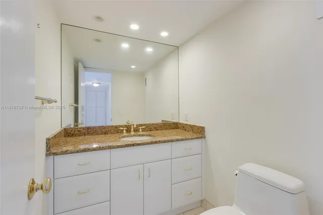 a view of an empty room with a fan