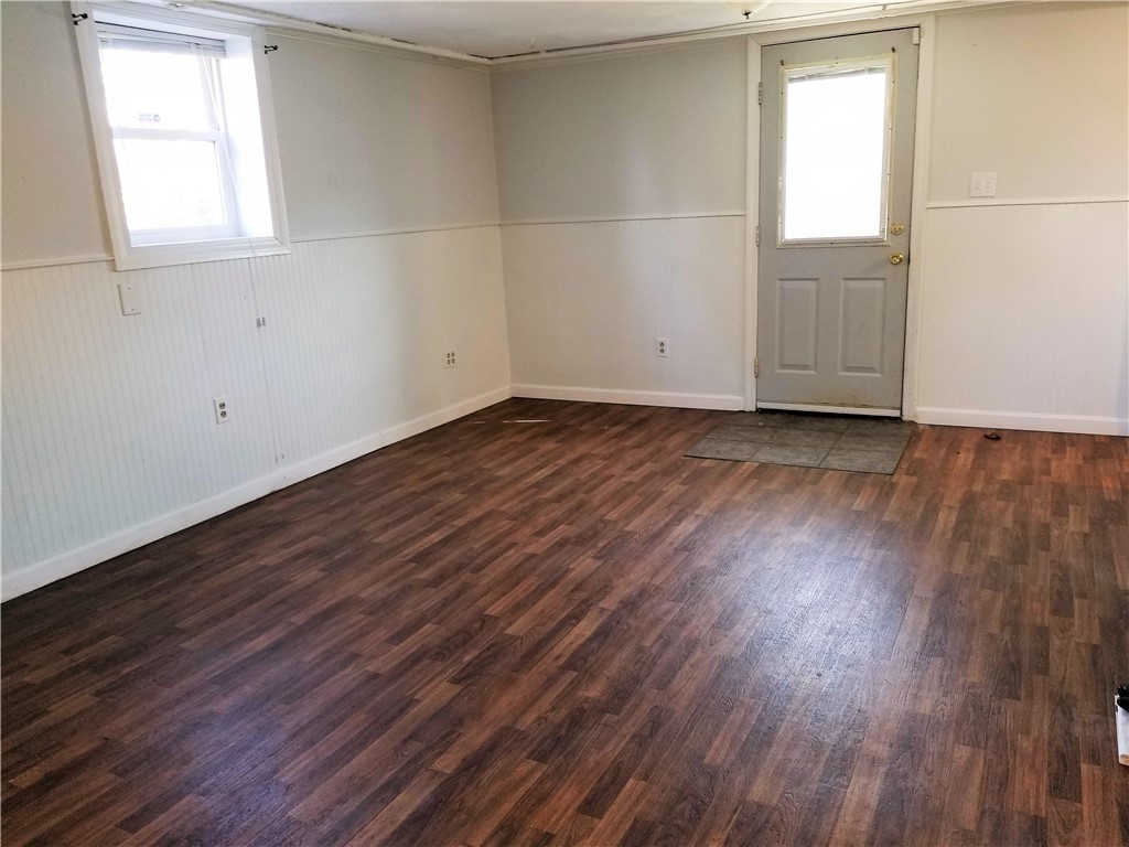 63 Long Meadow Road Portsmouth, RI 02871 - Photo 19 of 27 lower level living room with door to back yard