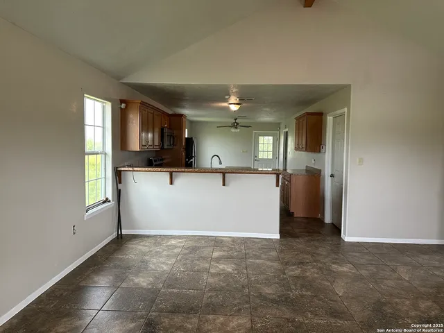 a kitchen with a sink a stove a refrigerator and a refrigerator
