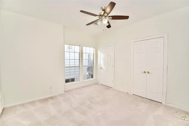 an empty room with fan