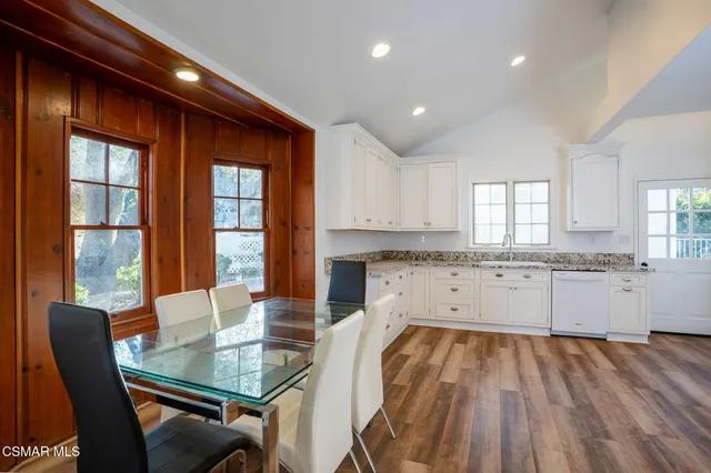 a kitchen with wooden cabinets and sink
