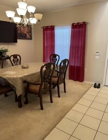 a couple of chairs sitting in a room with a rug