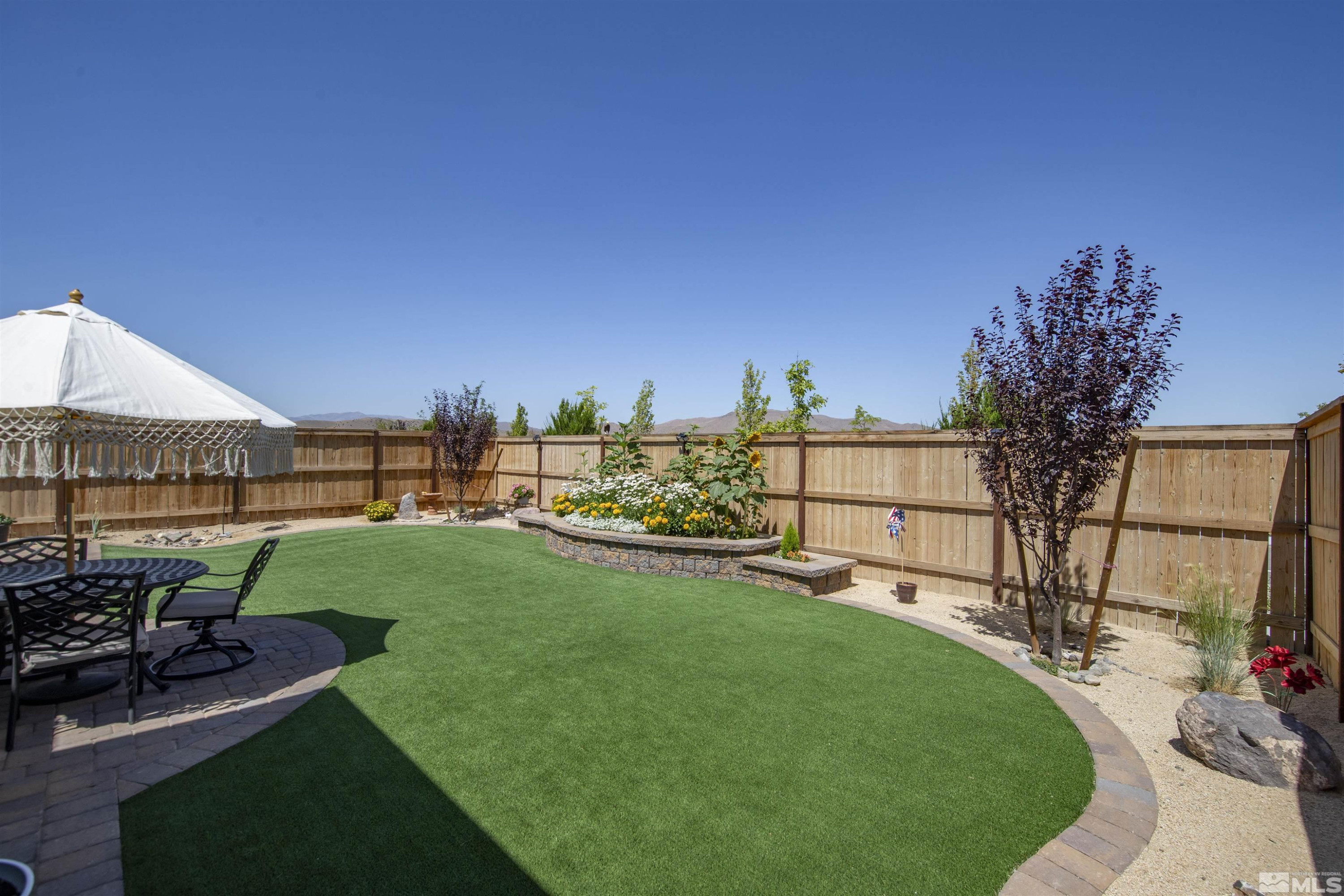 7341 Rustic Sky Drive Sparks, NV 89436 - Photo 32 of 40 a view of a garden with patio
