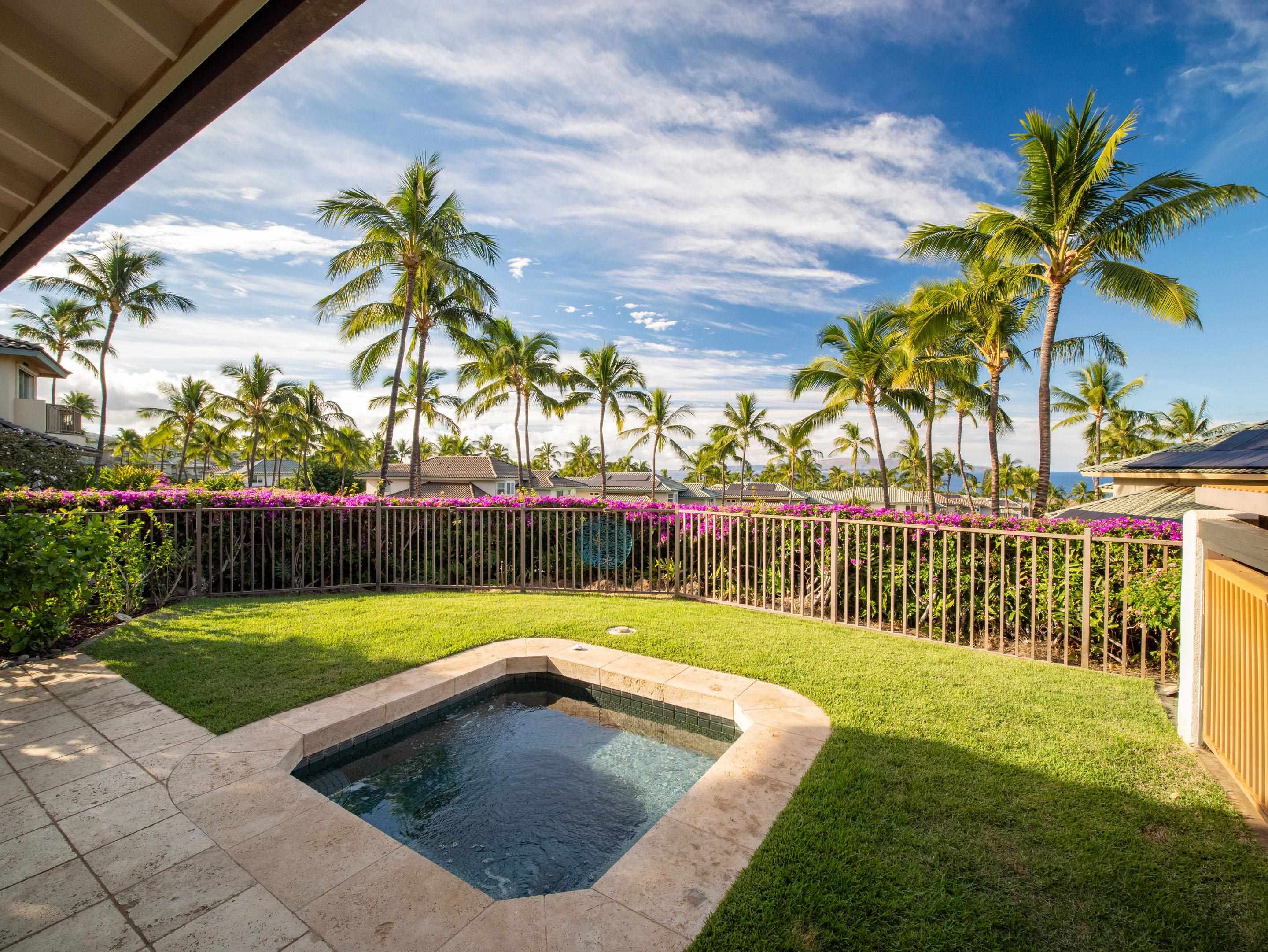 72 Kainui Loop, Unit 70A Kihei, HI 96753 - Photo 18 of 50 a view of a backyard with a garden